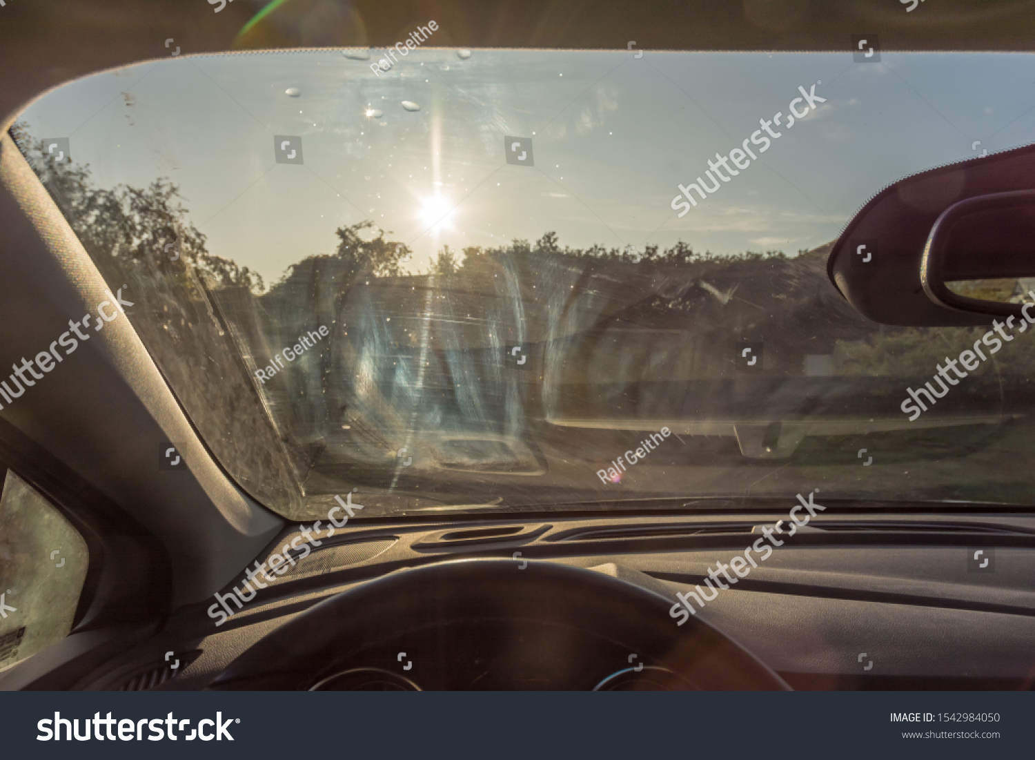 dirty-windshield-car-streaks-visual-obstruction-stock-photo-1542984050