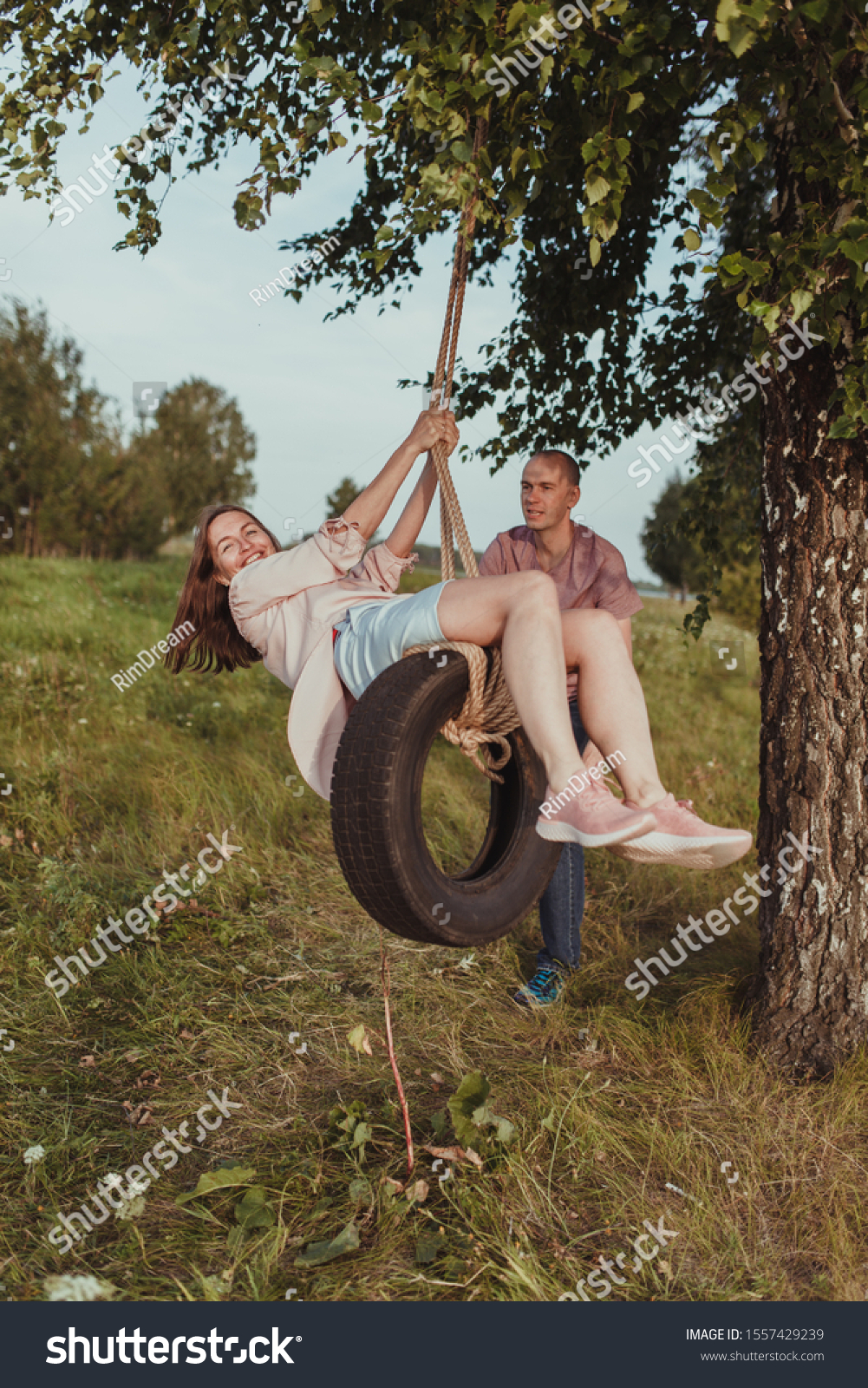 Happy Husband Wife Swing On Wheel Stock pic