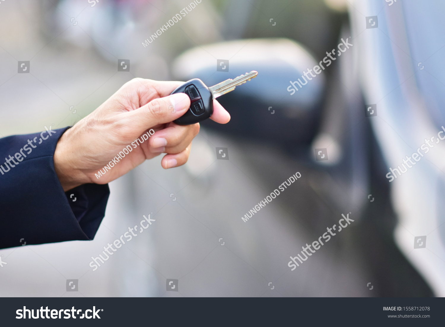 Salesman Holding Key Car Car Parked Stock Photo 1558712078 | Shutterstock