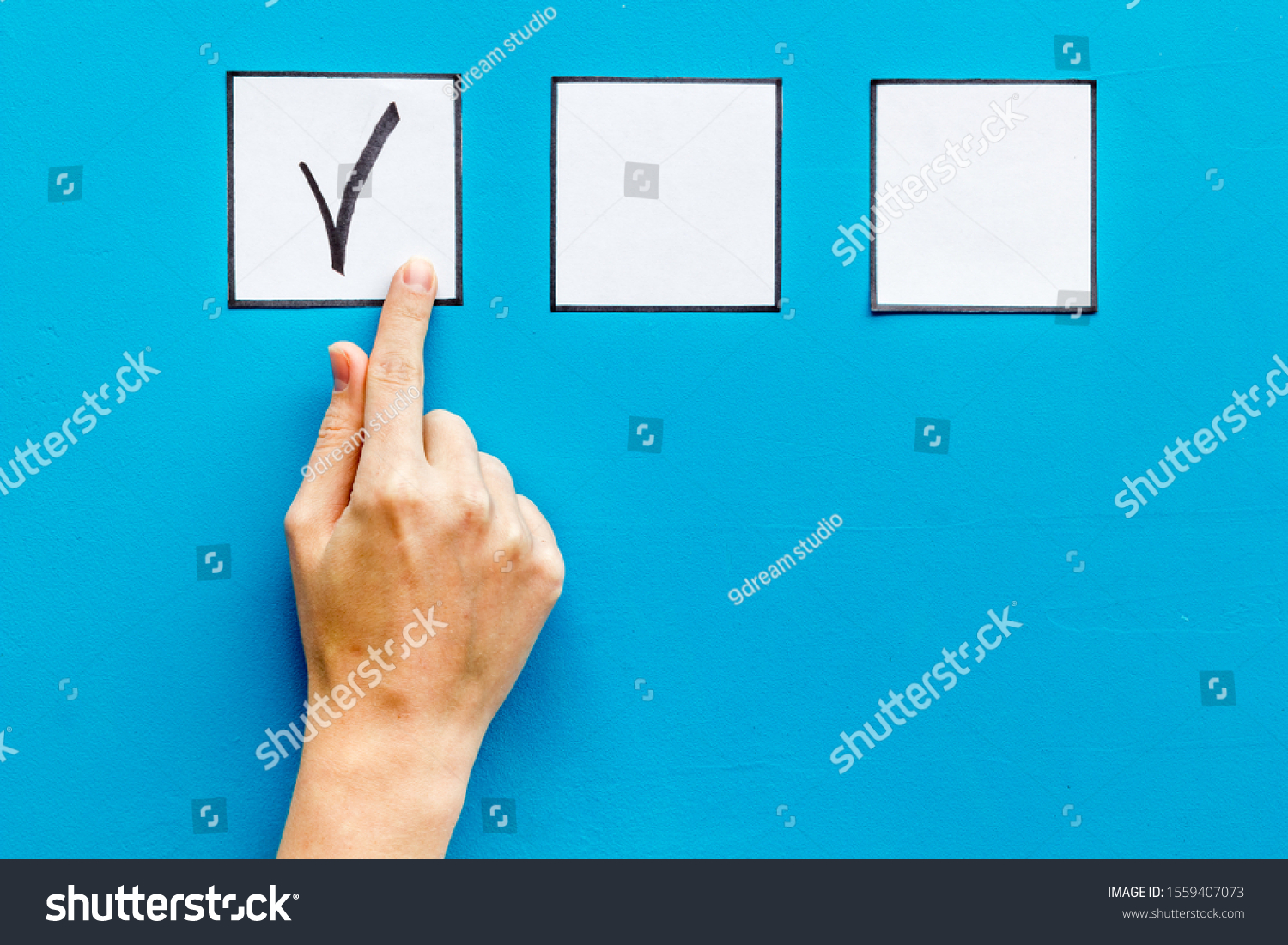 hand-put-check-mark-checkbox-on-stock-photo-1559407073-shutterstock