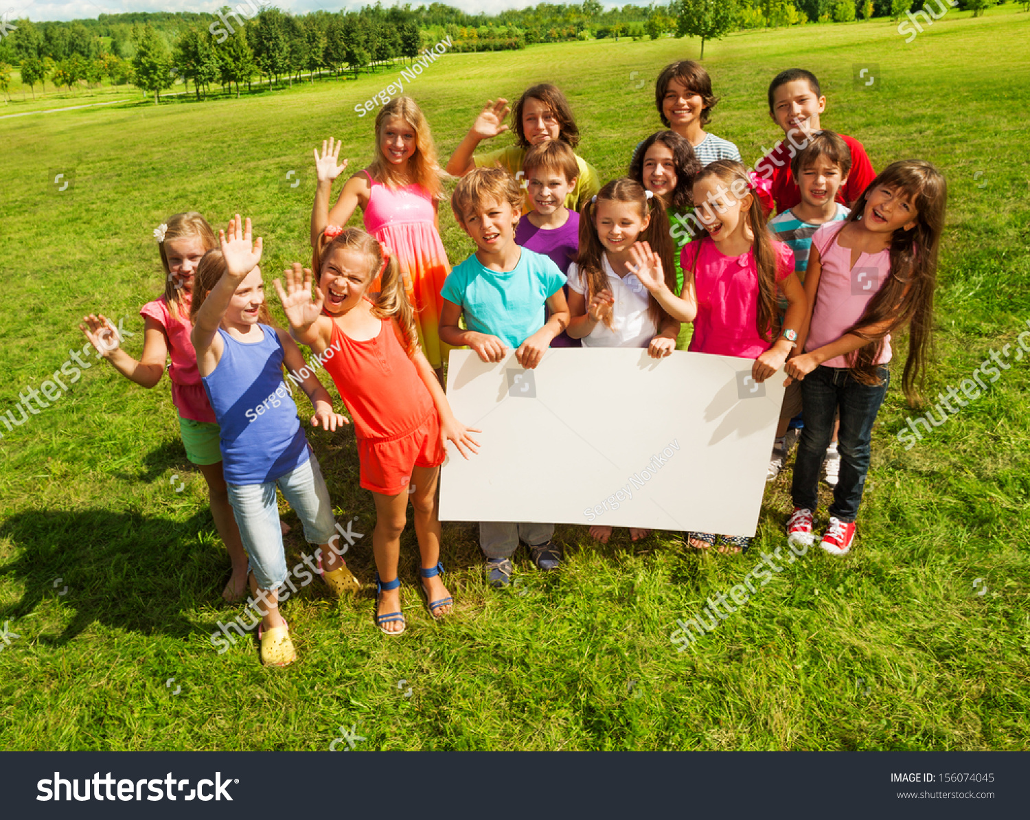 Group Kids Holding Blank Banner Showing Stock Photo (Edit Now) 156074045