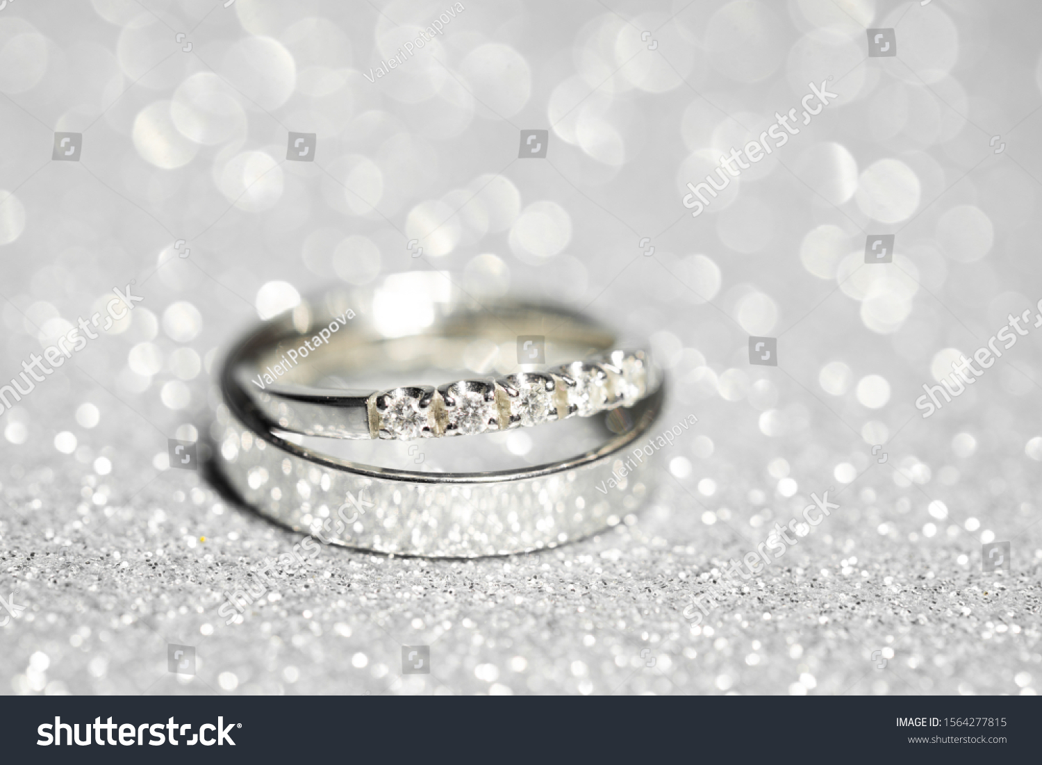 Pair Platinum Wedding Rings Glitter Background Stock Photo 1564277815 ...