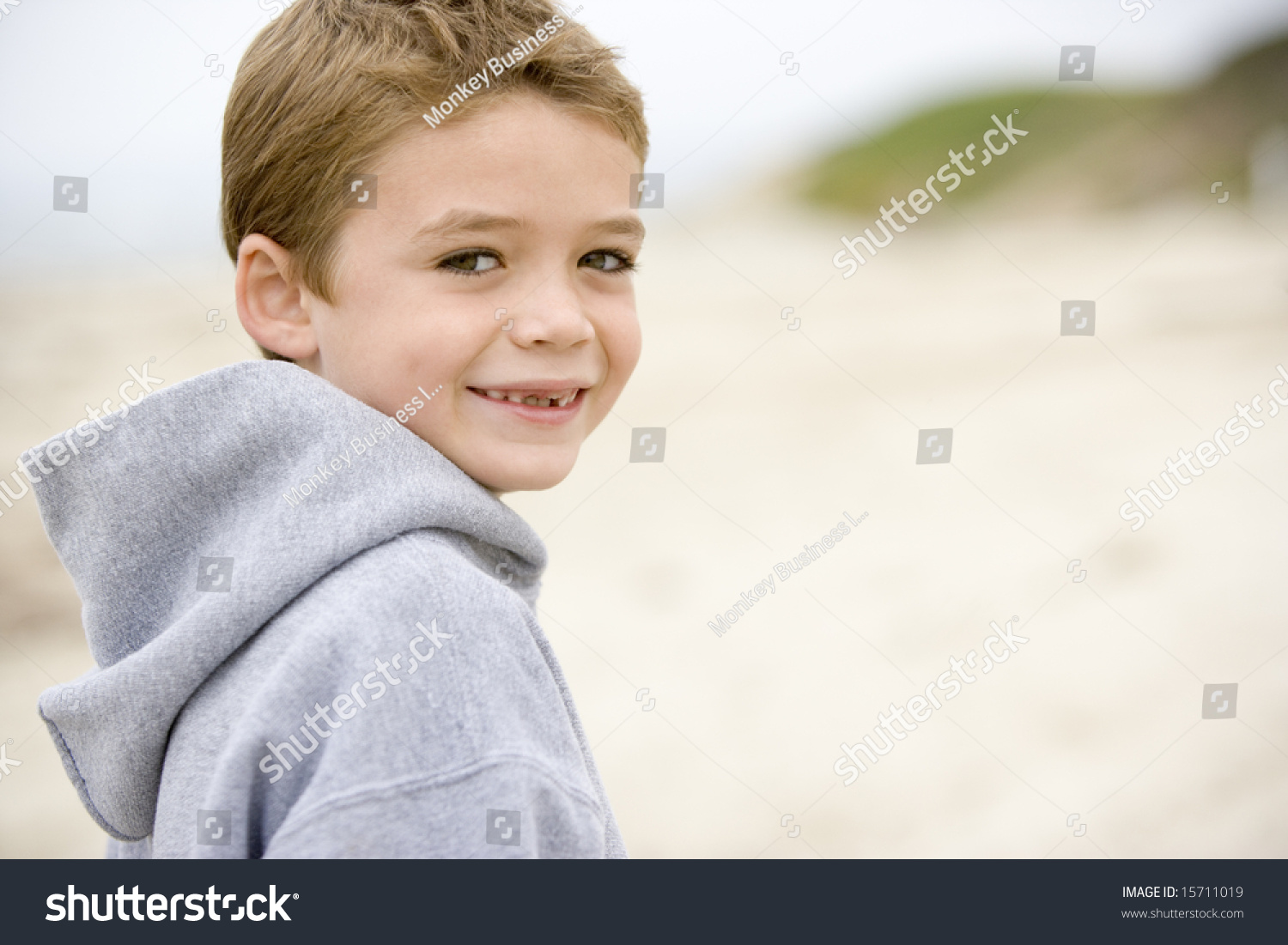 Young Boy Standing On Beach Smiling Stock Photo 15711019 | Shutterstock