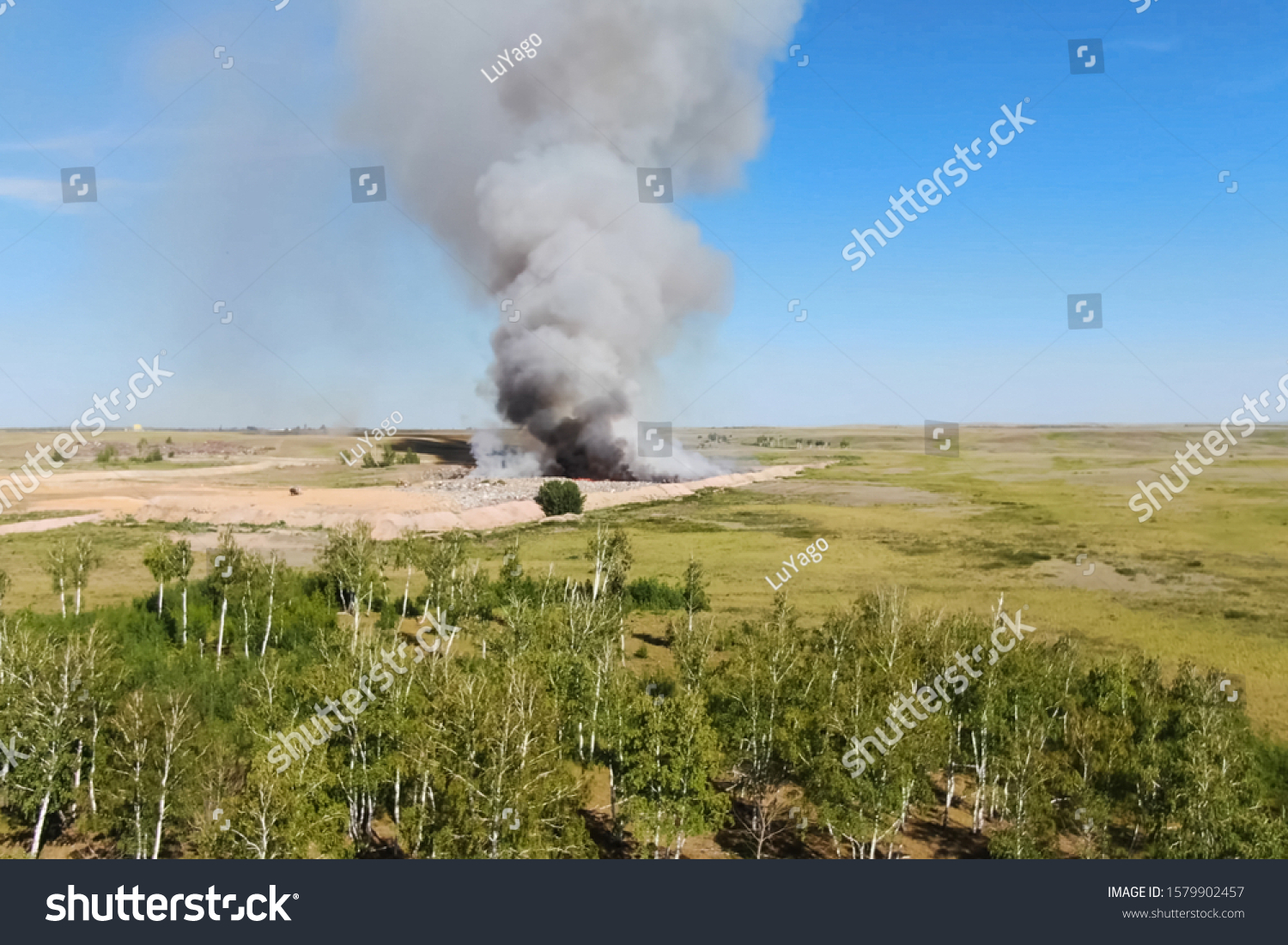 burning-trash-fire-landfill-burning-garbage-stock-photo-1579902457