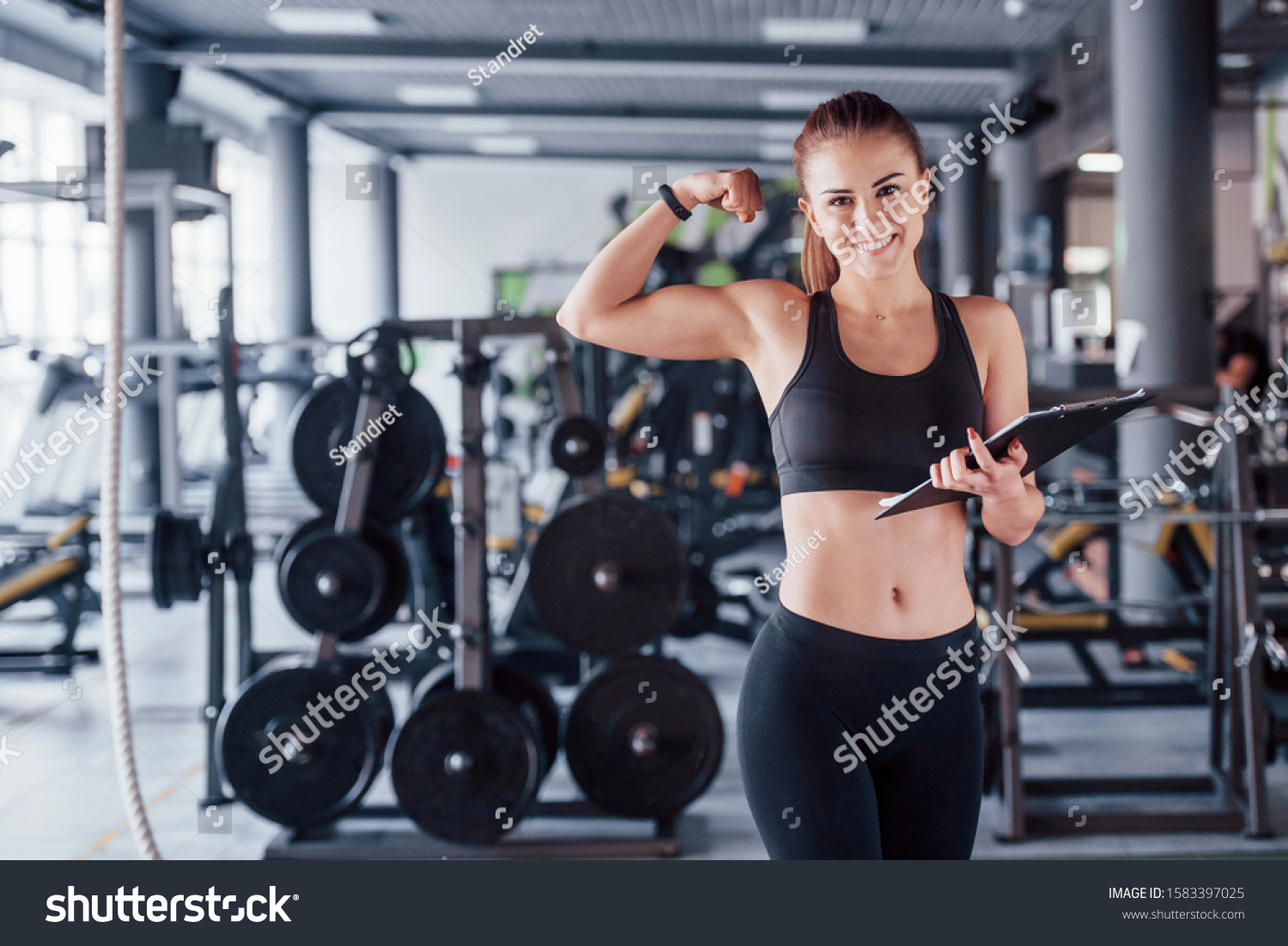 Young Female Fitness Personal Trainer Standing Stock Photo 1583397025 ...