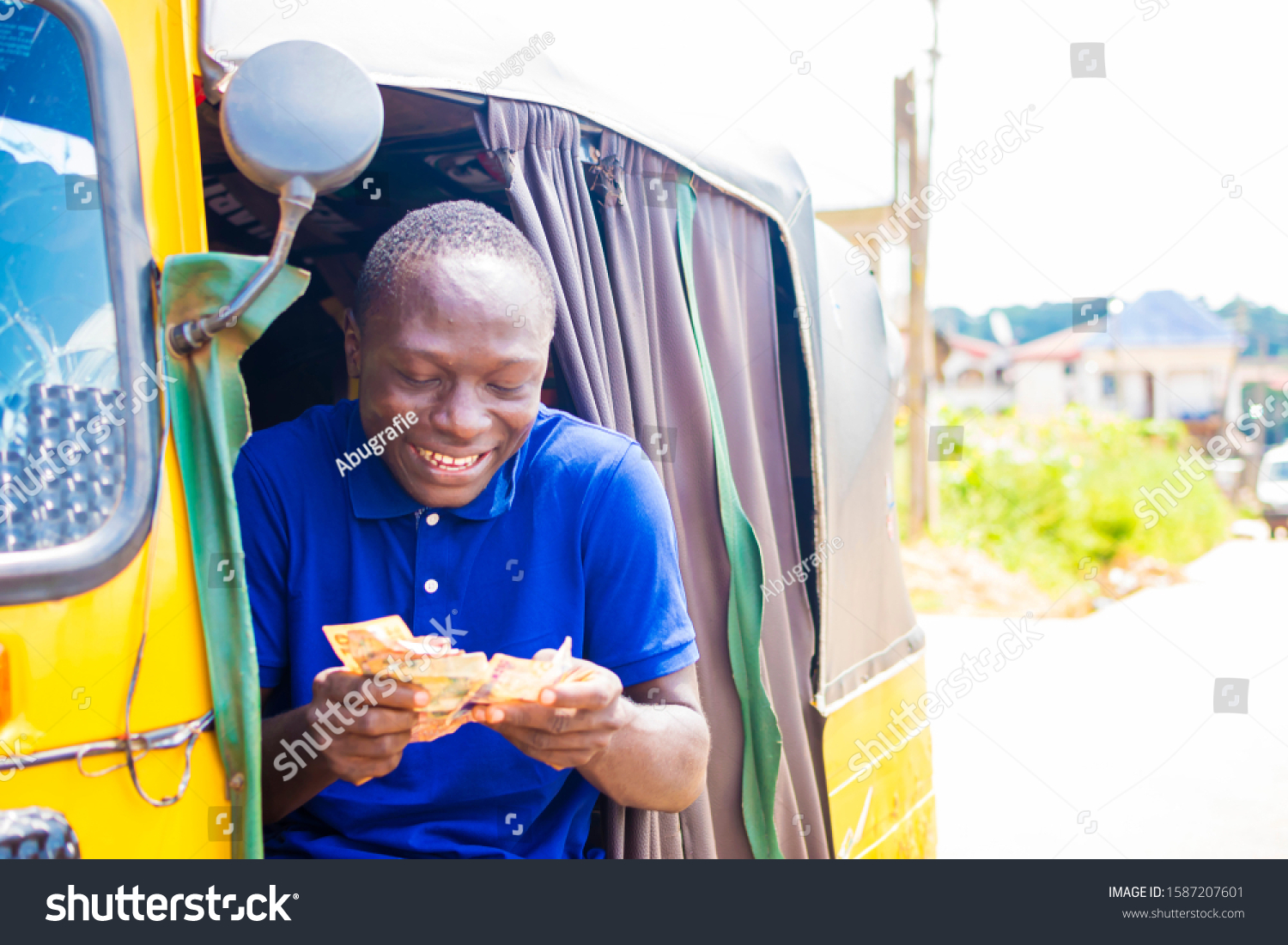 Young Black African Tricycle Driver Sitting Stock Photo 1587207601 ...