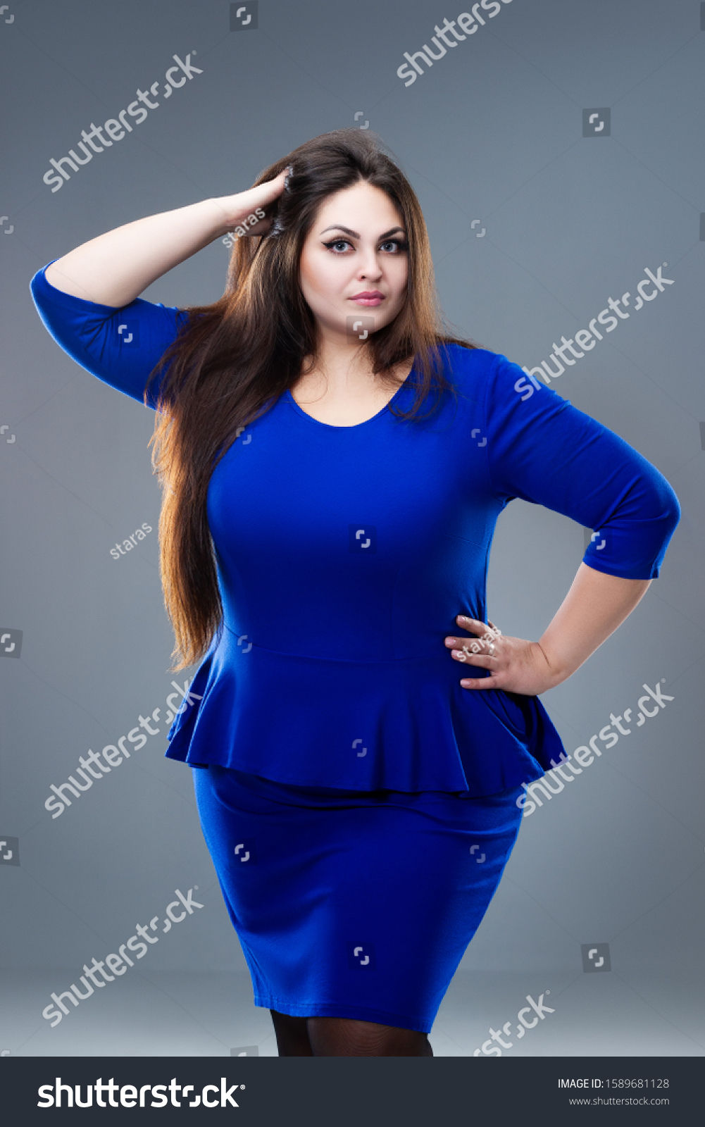 plus-size-model-blue-dress-fat-stock-photo-1589681128-shutterstock