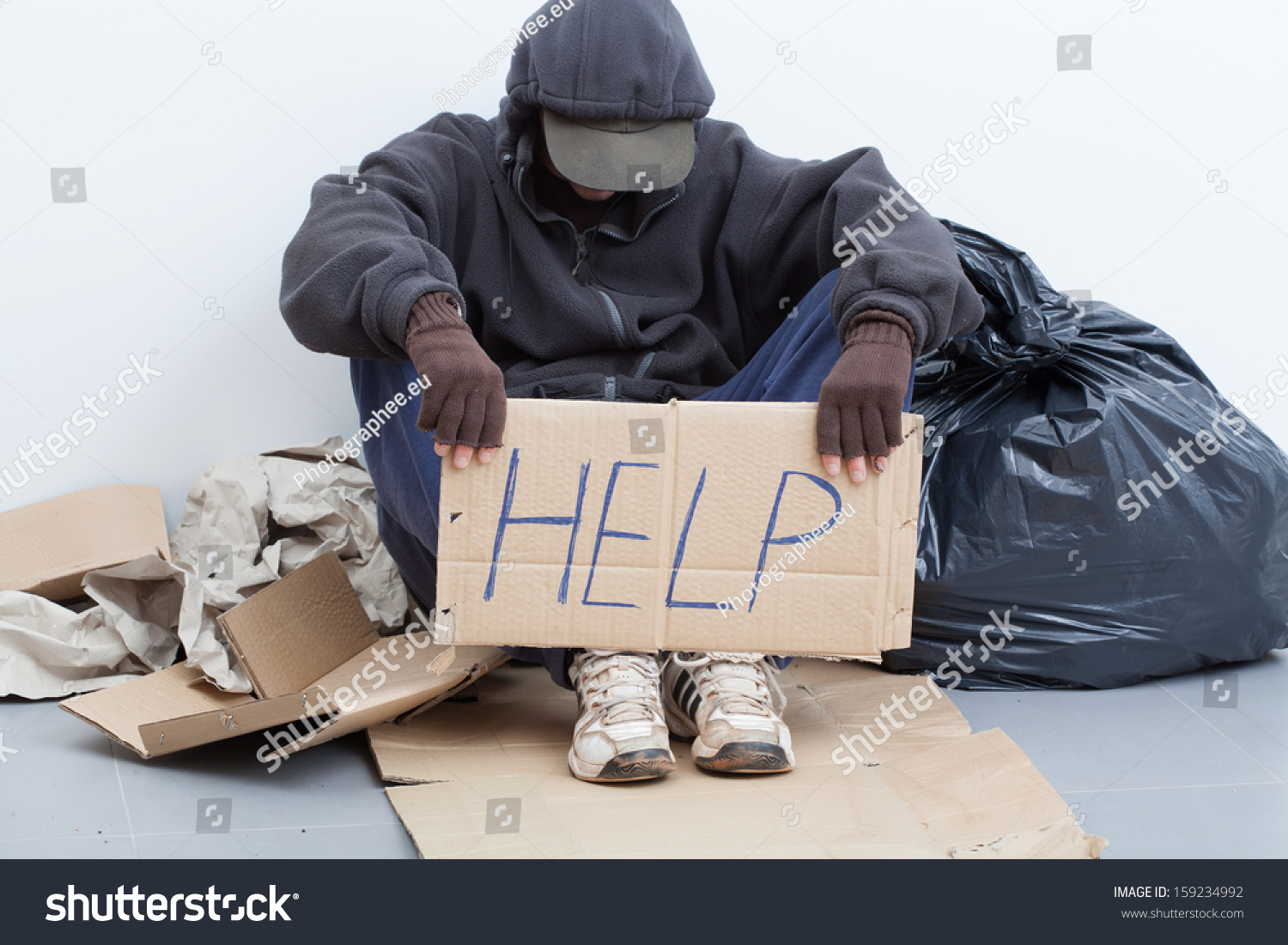 Homeless Man Sitting On Street Sign Stock Photo 159234992 | Shutterstock