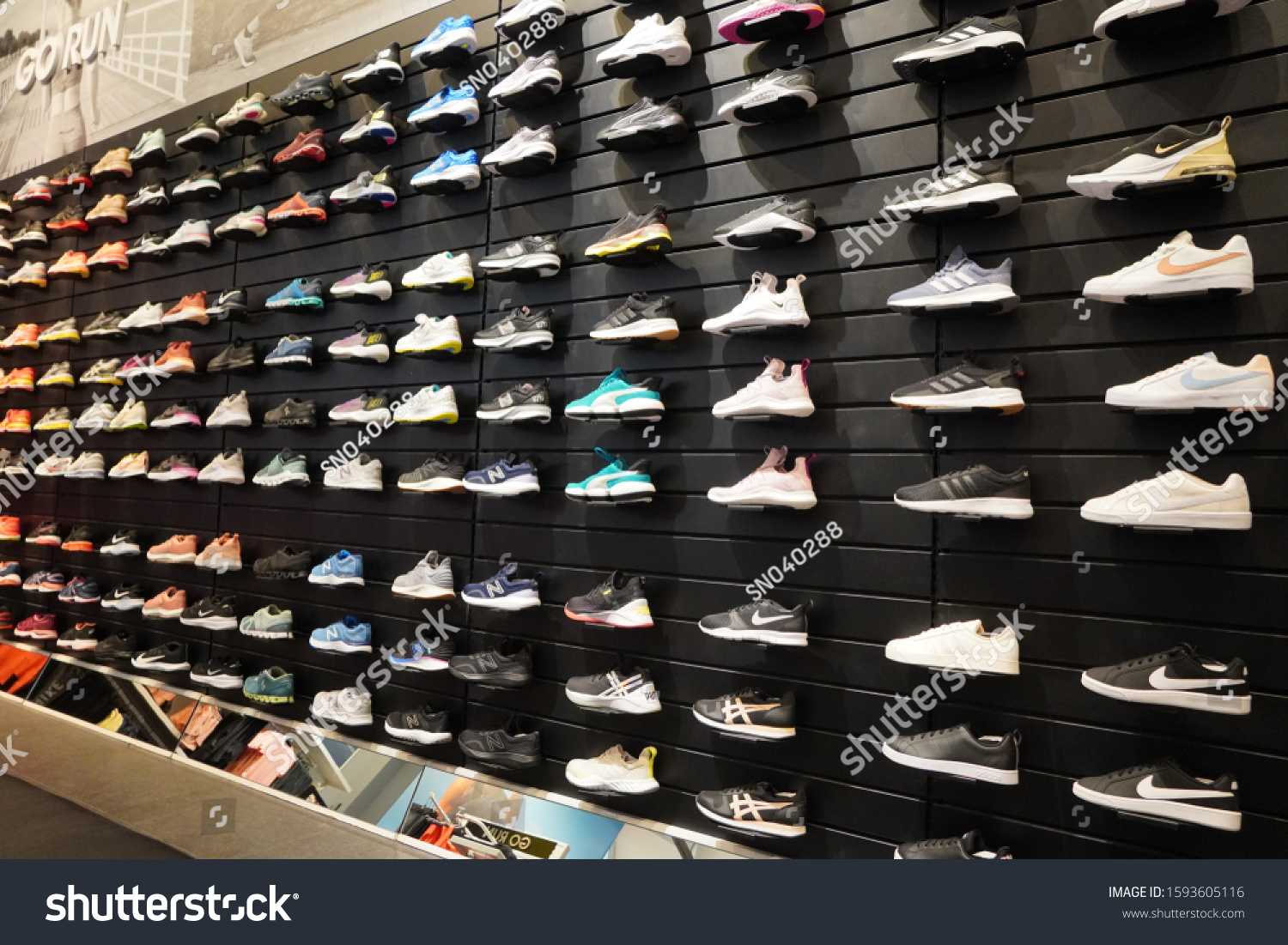Shop Display Sports Shoes On Wall Stock Photo 1593605116 | Shutterstock