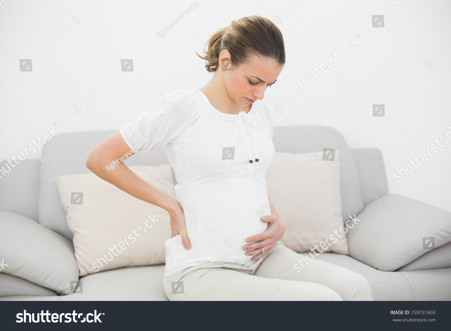 Worried Pregnant Woman Touching Her Injured Stock Photo 159731603 ...