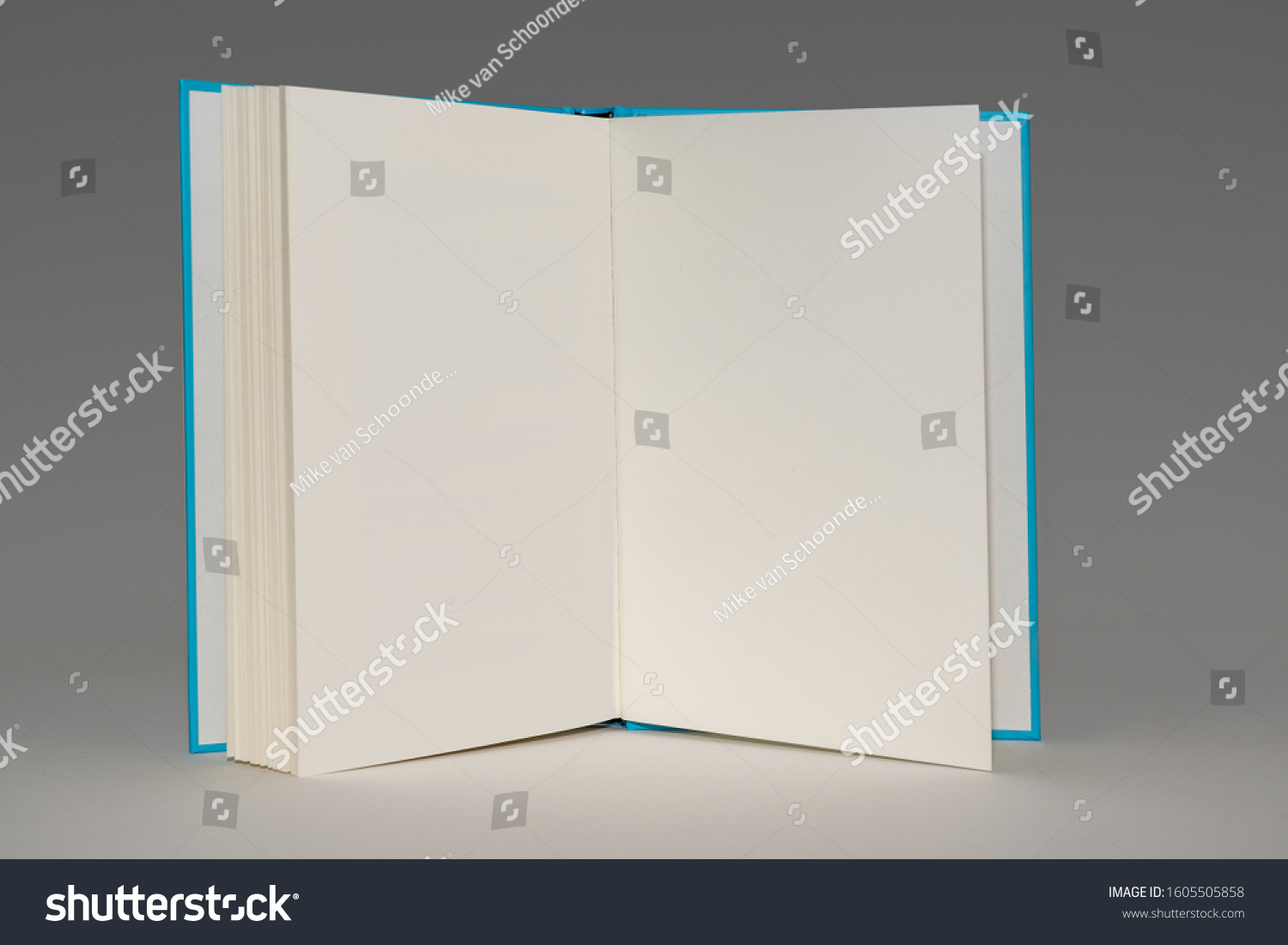 Open Book Blue Cover Showing Empty Stock Photo 1605505858 | Shutterstock