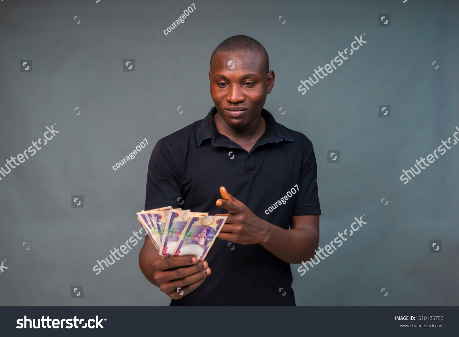 Young Black Man Holding Some Money Stock Photo 1610125753 | Shutterstock