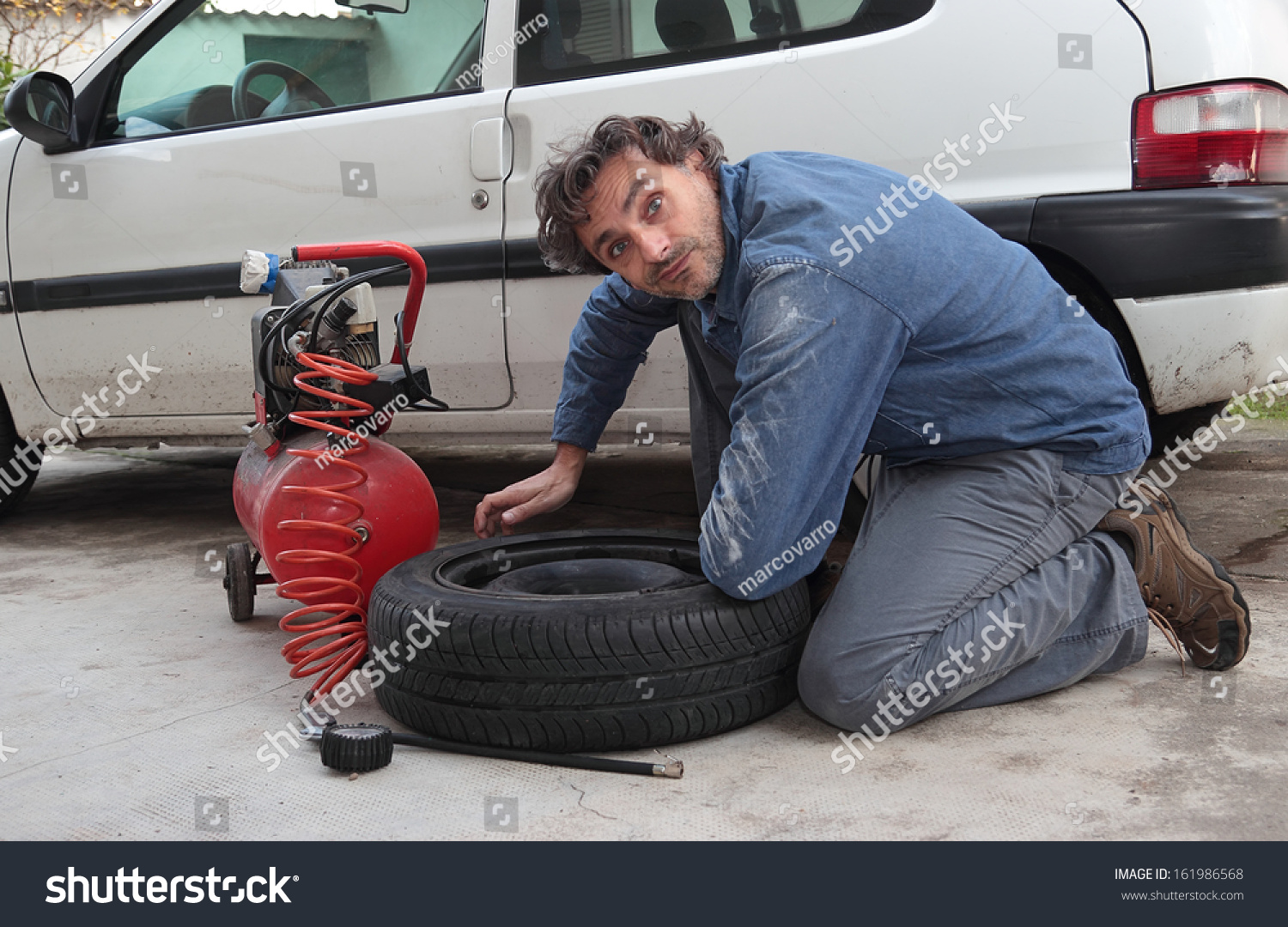 29 Funny Flat Tire Stock Photos Images Photography Shutterstock   Stock Photo Funny Man And Car Spare Tire 161986568 