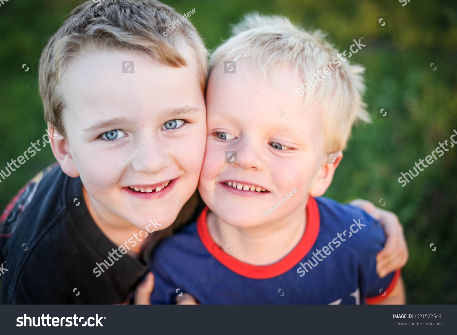 Two Young Brothers Hugging Faces Pressed Stock Photo 1621522549 ...