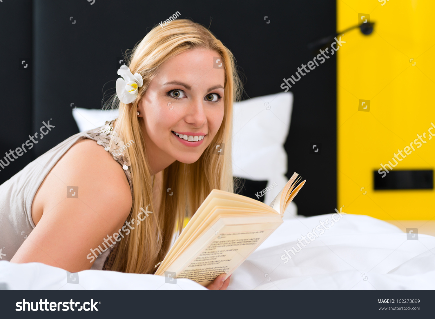 young-woman-lying-bed-hotel-room-stock-photo-162273899-shutterstock