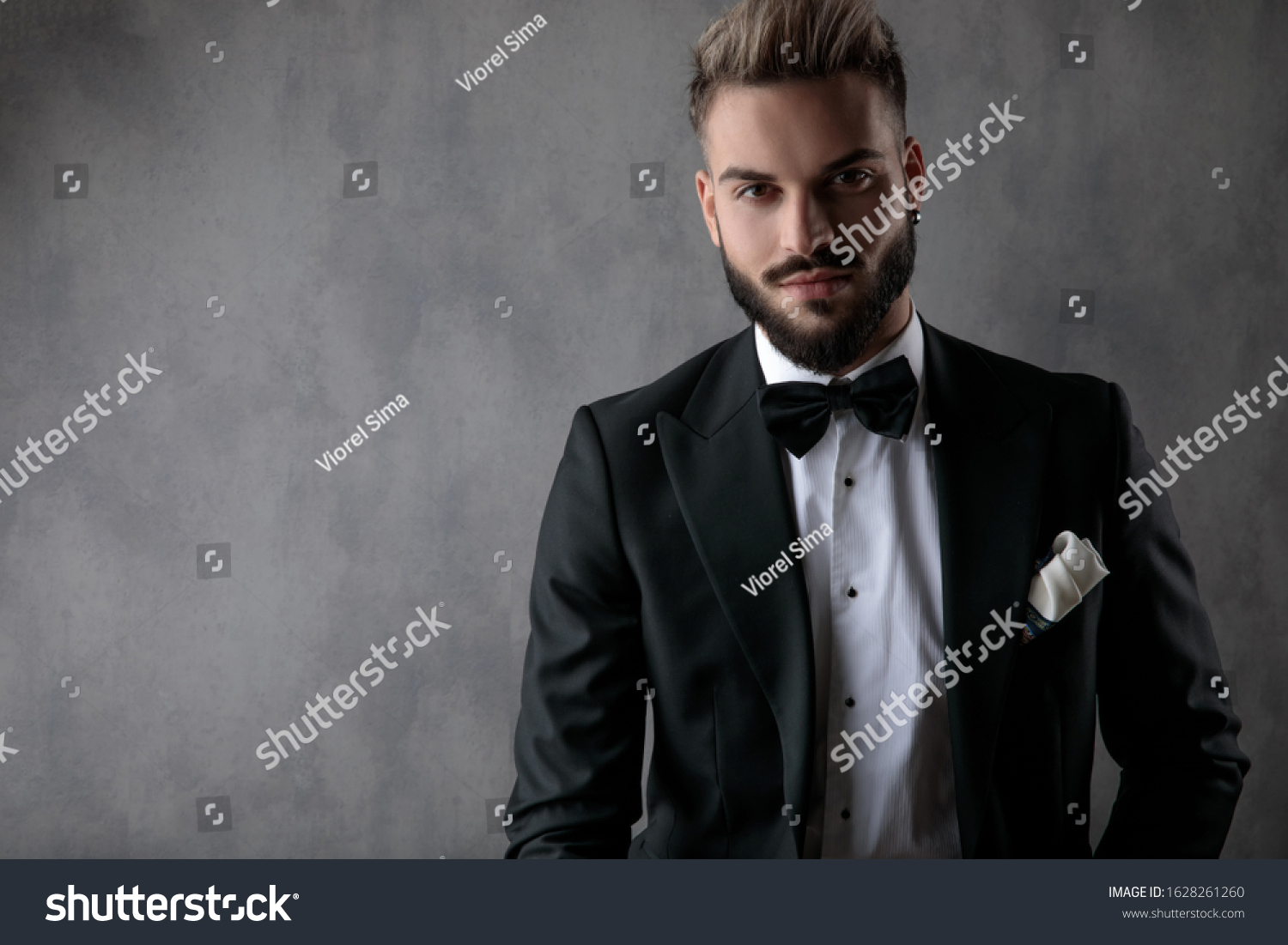 Handsome Businessman Wearing Black Tuxedo Sitting Stock Photo ...