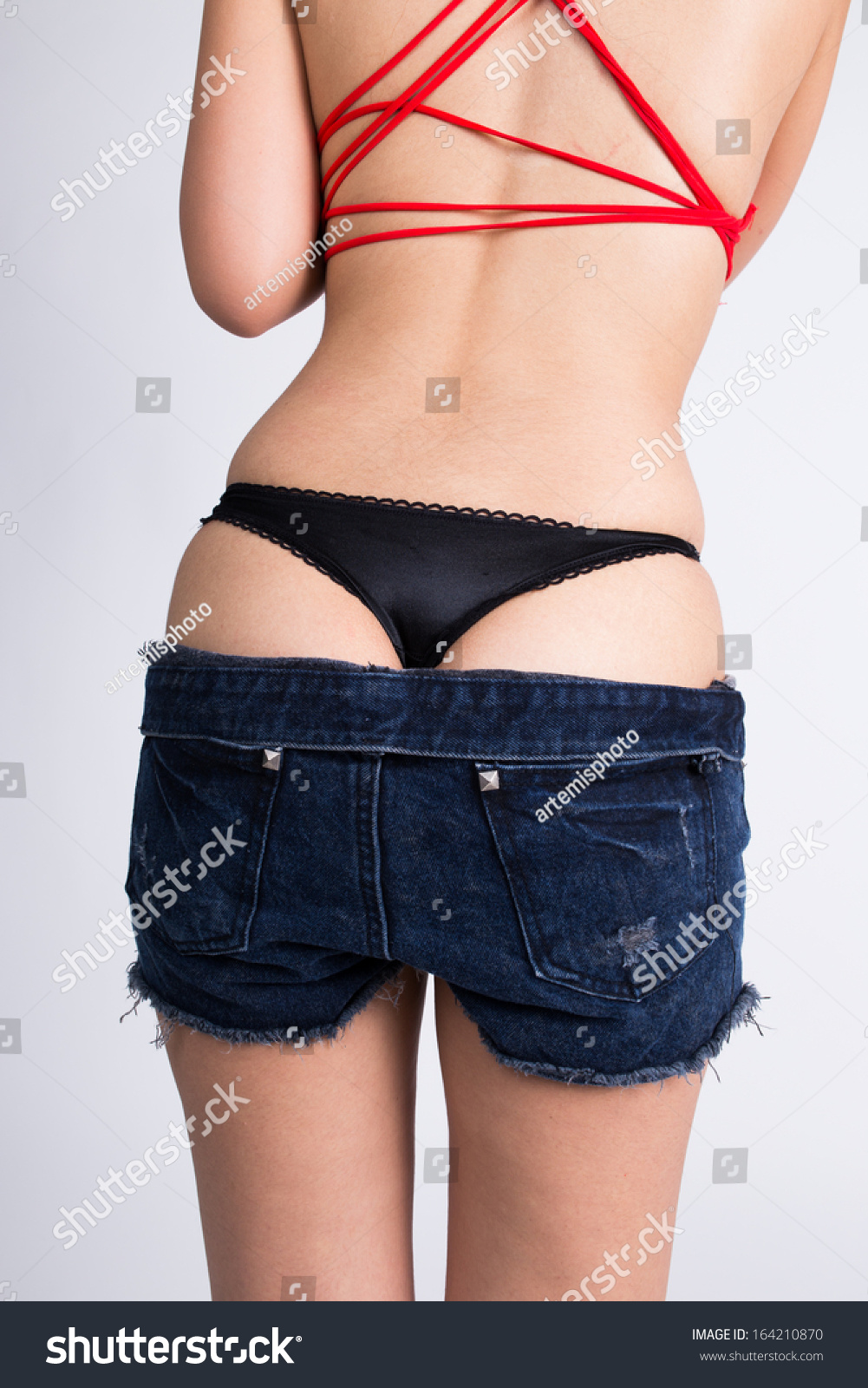 Photo de stock Woman Take Off Her Short Jean 164210870 Shutterstock.