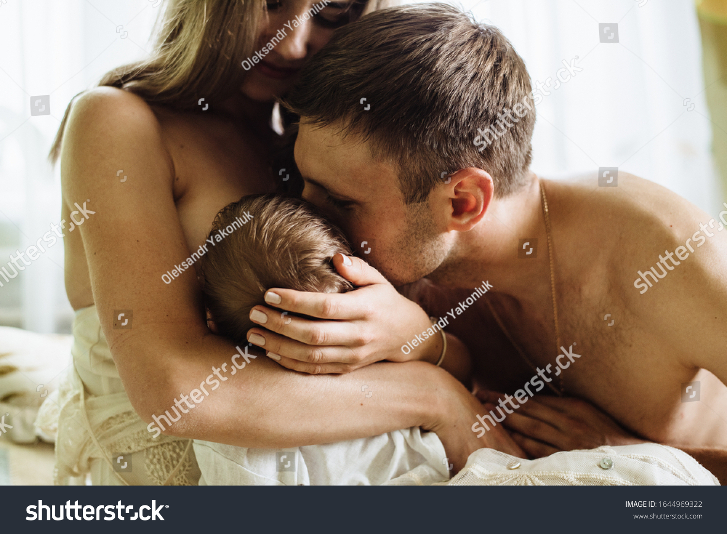 Husband Kisses His Wife While She Stock