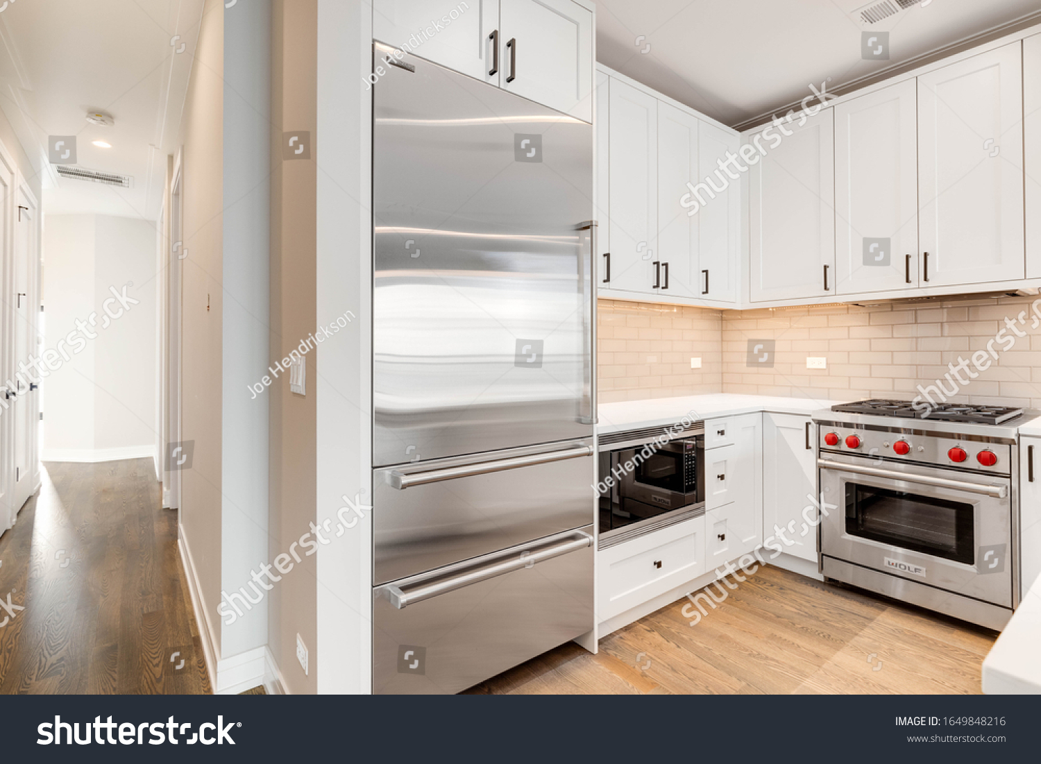 Stock Photo Chicago Il Usa January A Modern All White Kitchen In A Downtown Condominium With 1649848216 