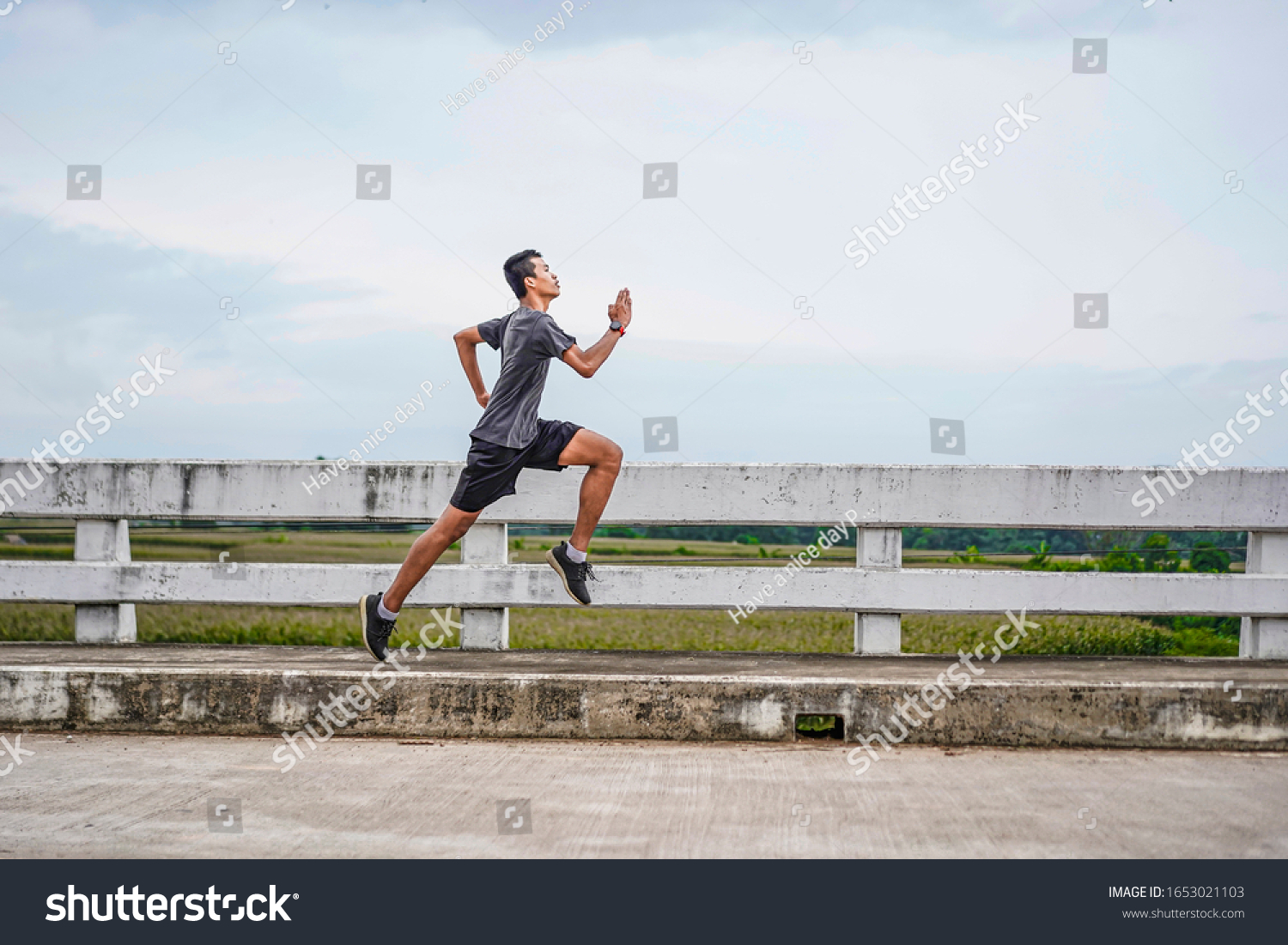 Asian Teenager Running Along Bridge Sprinting Stock Photo 1653021103 ...