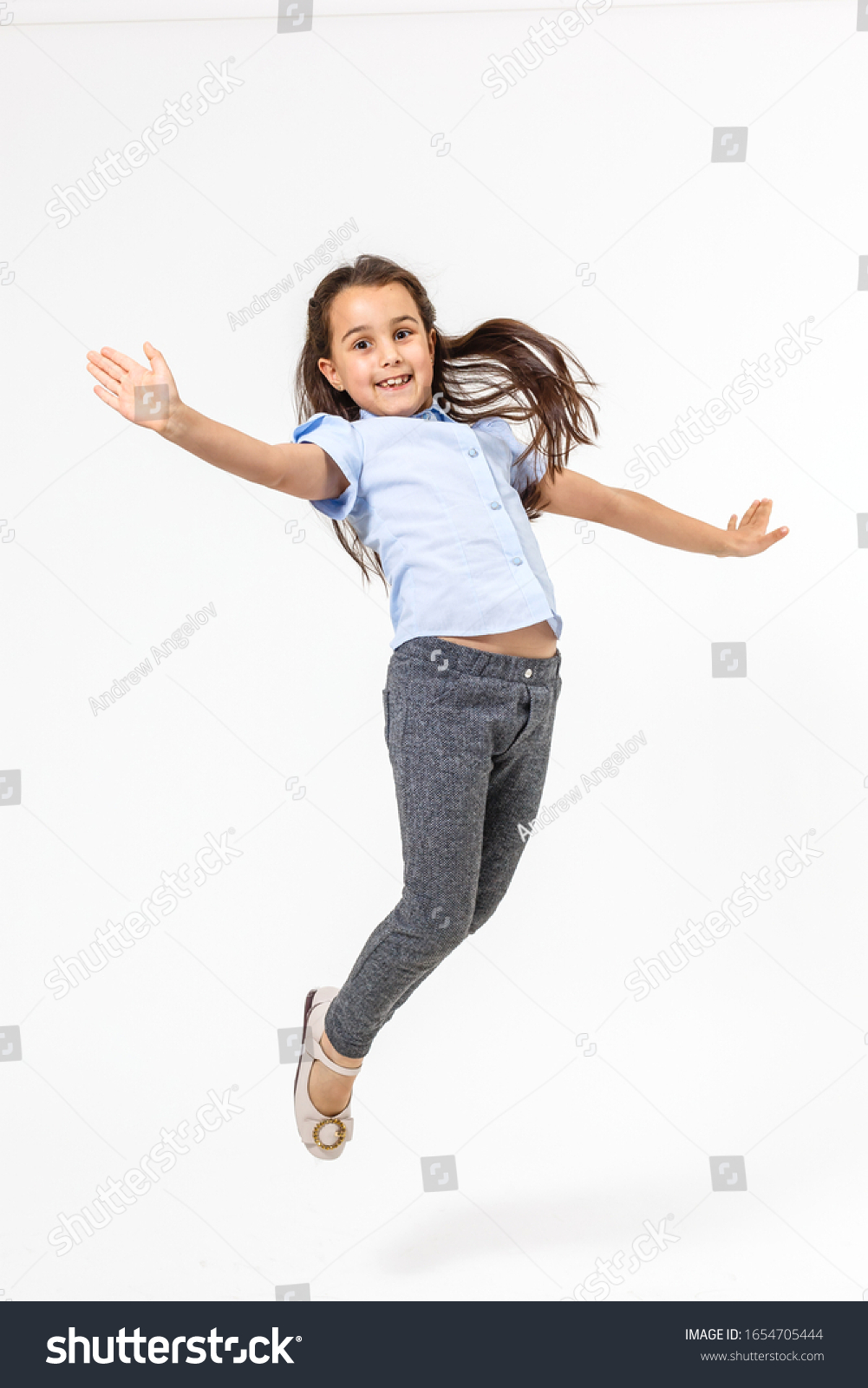 Little Girl Jumps On White Background Stock Photo 1654705444 | Shutterstock