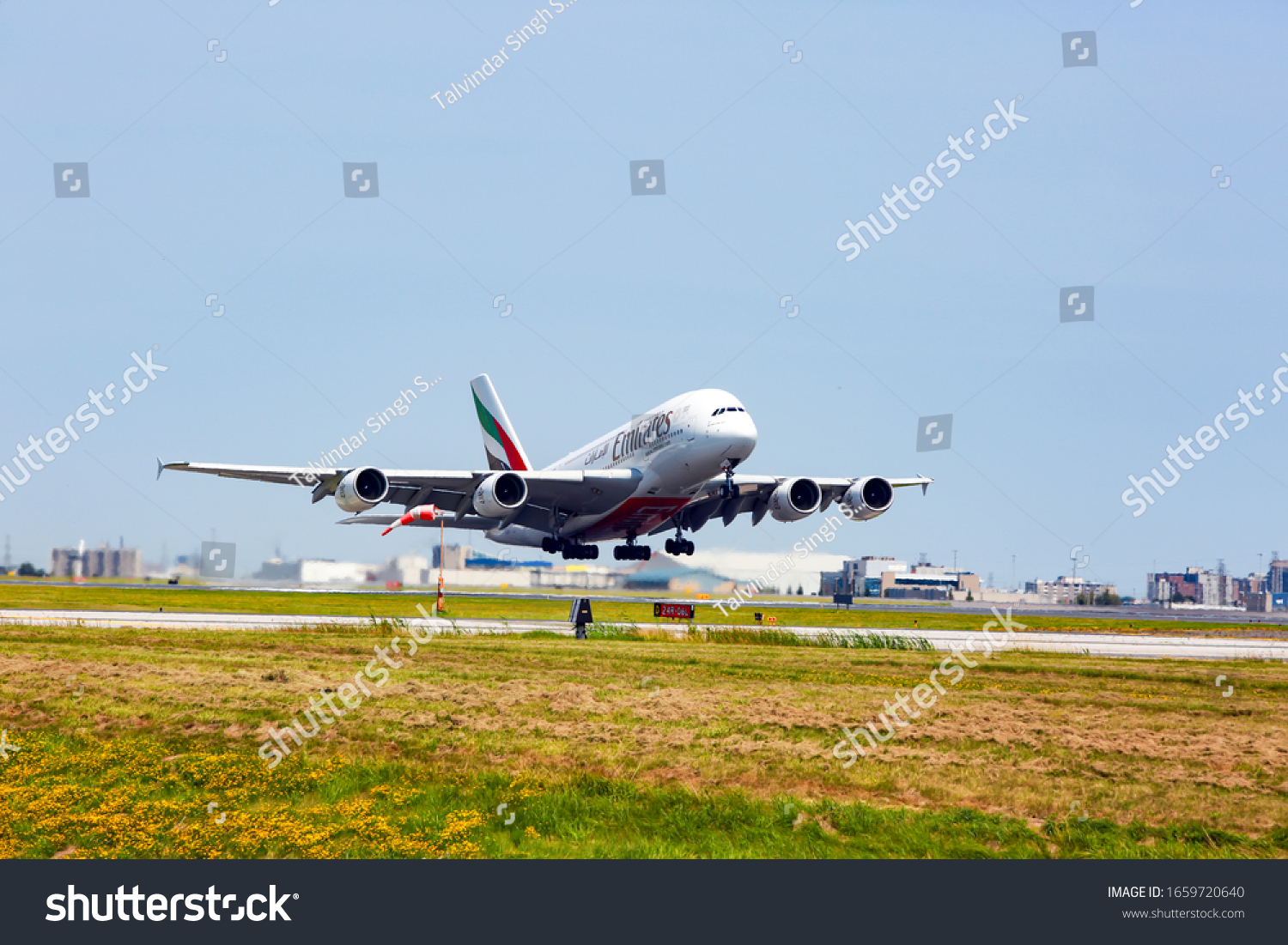 emirates-flight-dubai-taking-off-yyz-stock-photo-1659720640-shutterstock