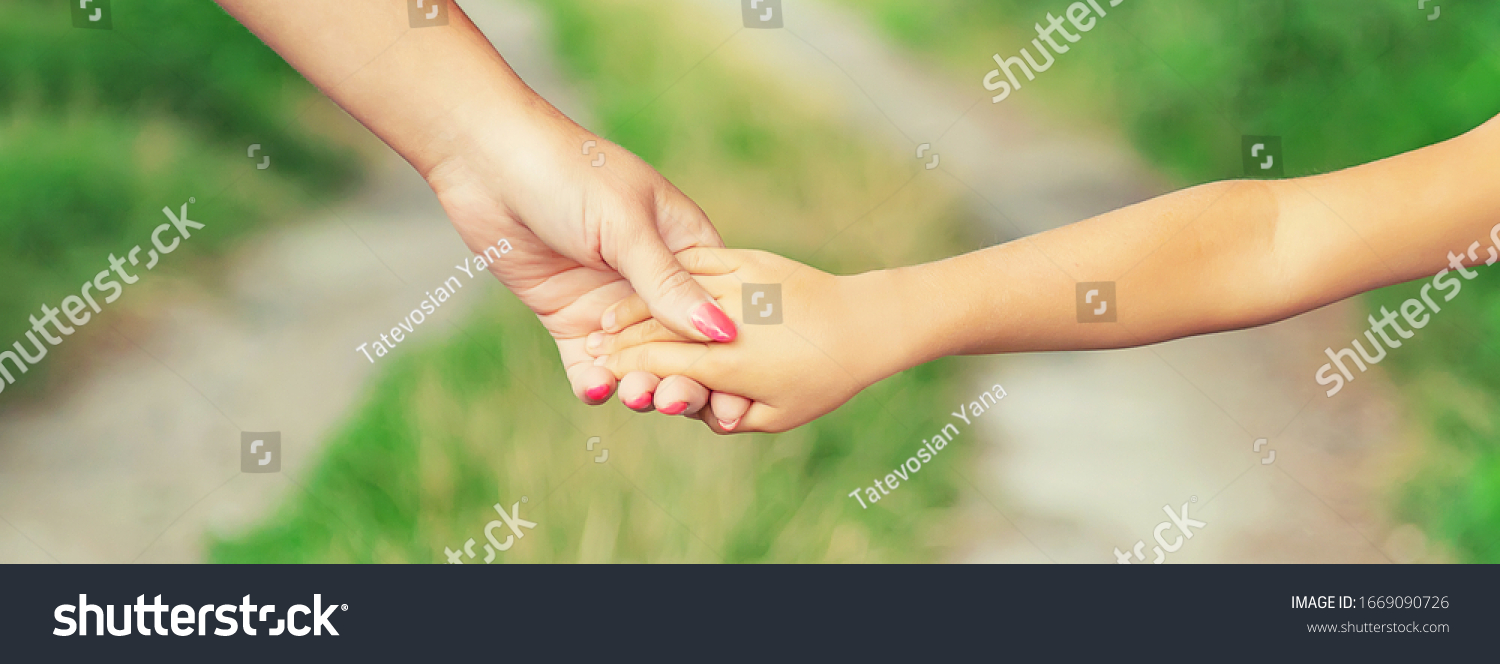 child-goes-hand-hand-his-mother-stock-photo-1669090726-shutterstock