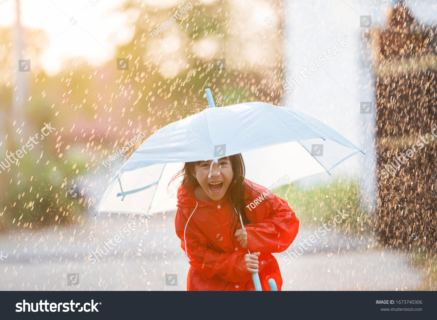 Asian Children Spreading Umbrellas Playing Rain Stock Photo 1673740306 ...