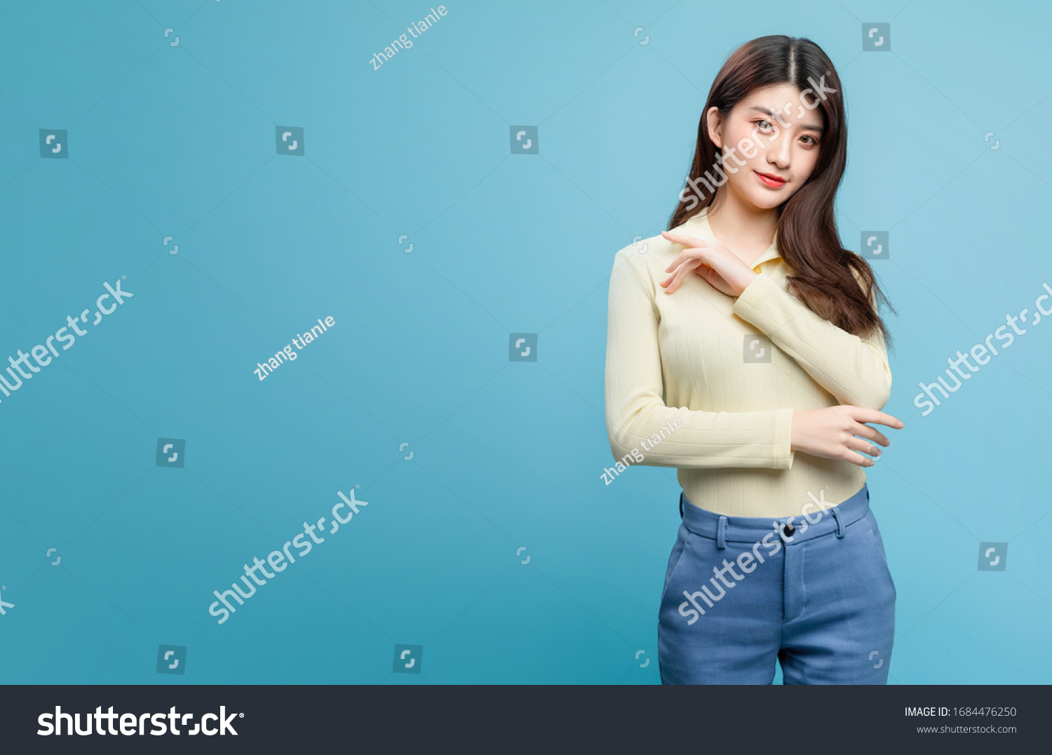 Asian Girl On Blue Background Stock Photo 1684476250 | Shutterstock