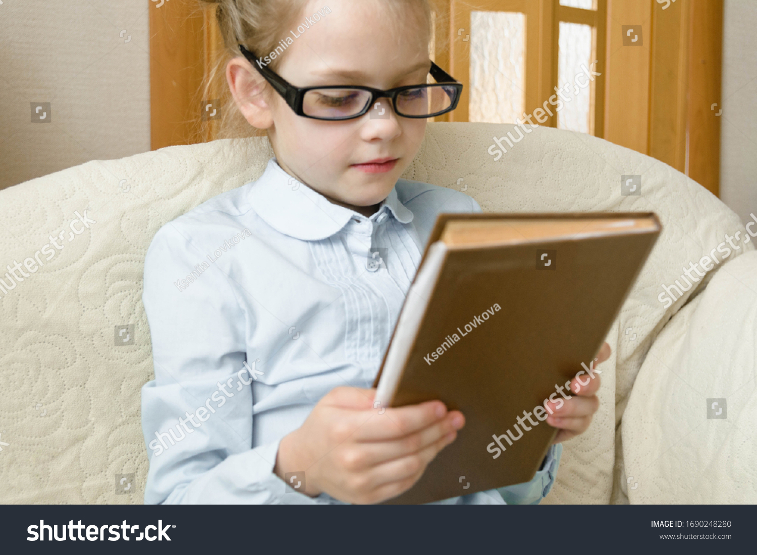 little-girl-reading-interesting-book-stock-photo-1690248280-shutterstock