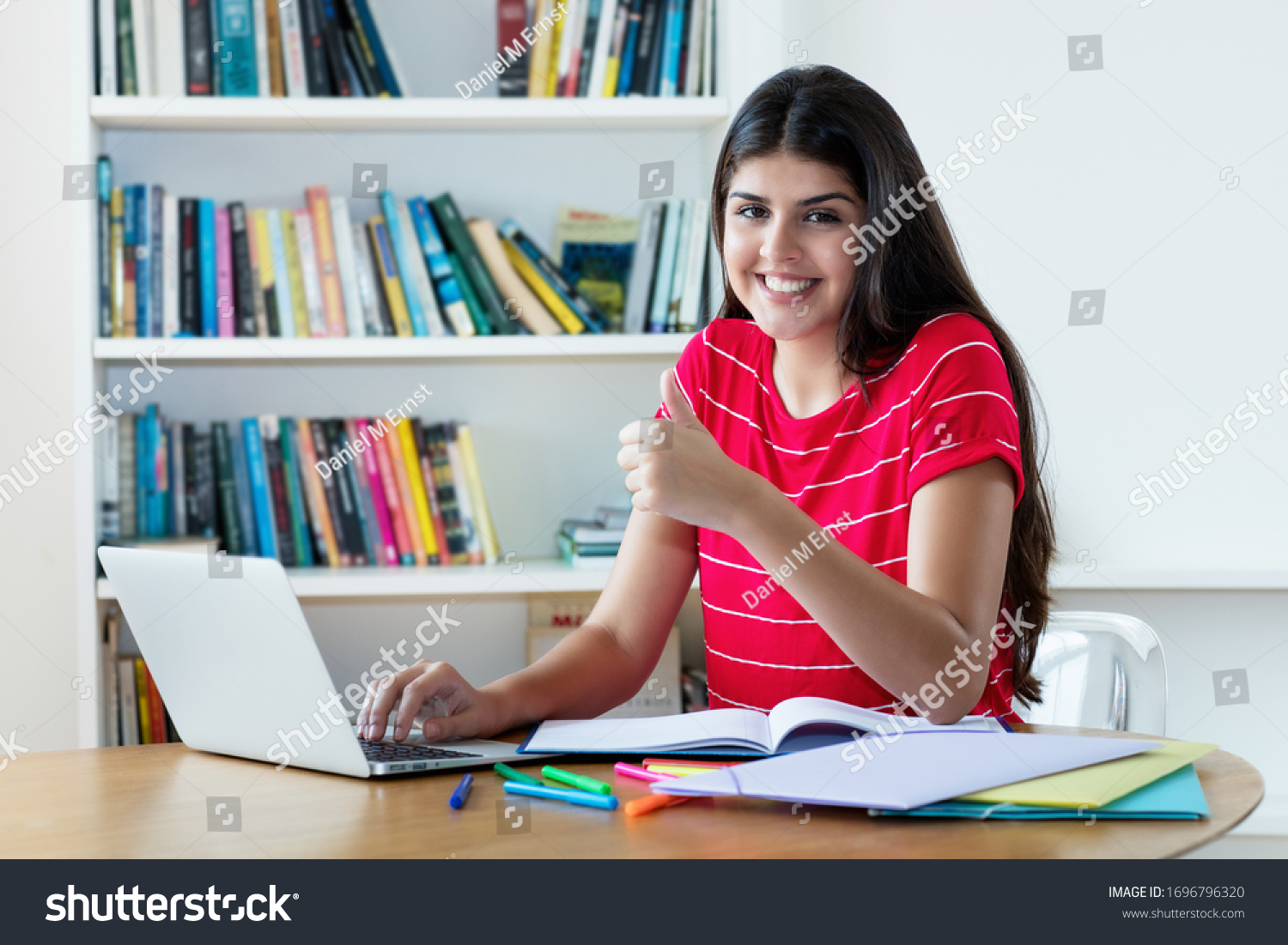 Beautiful Hispanic Female Student Learning Language Stock Photo ...