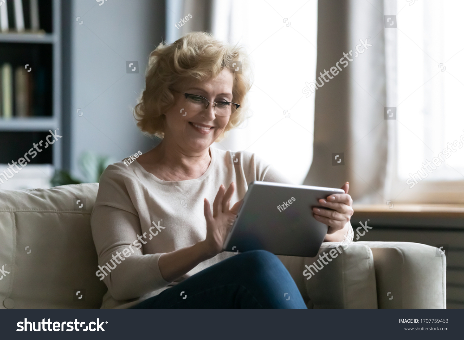 Middleaged Woman Sitting On Sofa Living Stock Photo 1707759463 ...