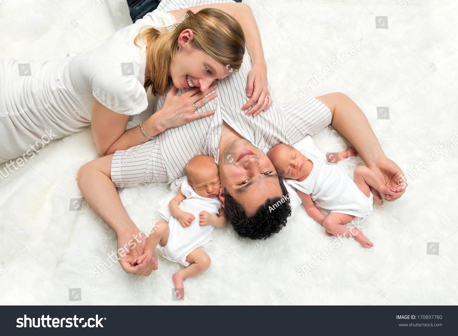 happy-family-portrait-two-young-parents-stock-photo-170897780