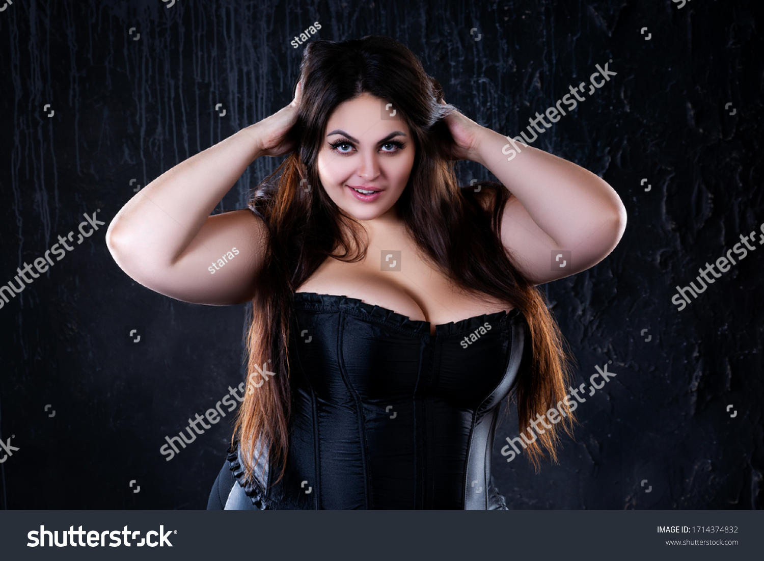 sexy-plus-size-model-black-corset-stock-photo-1714374832-shutterstock