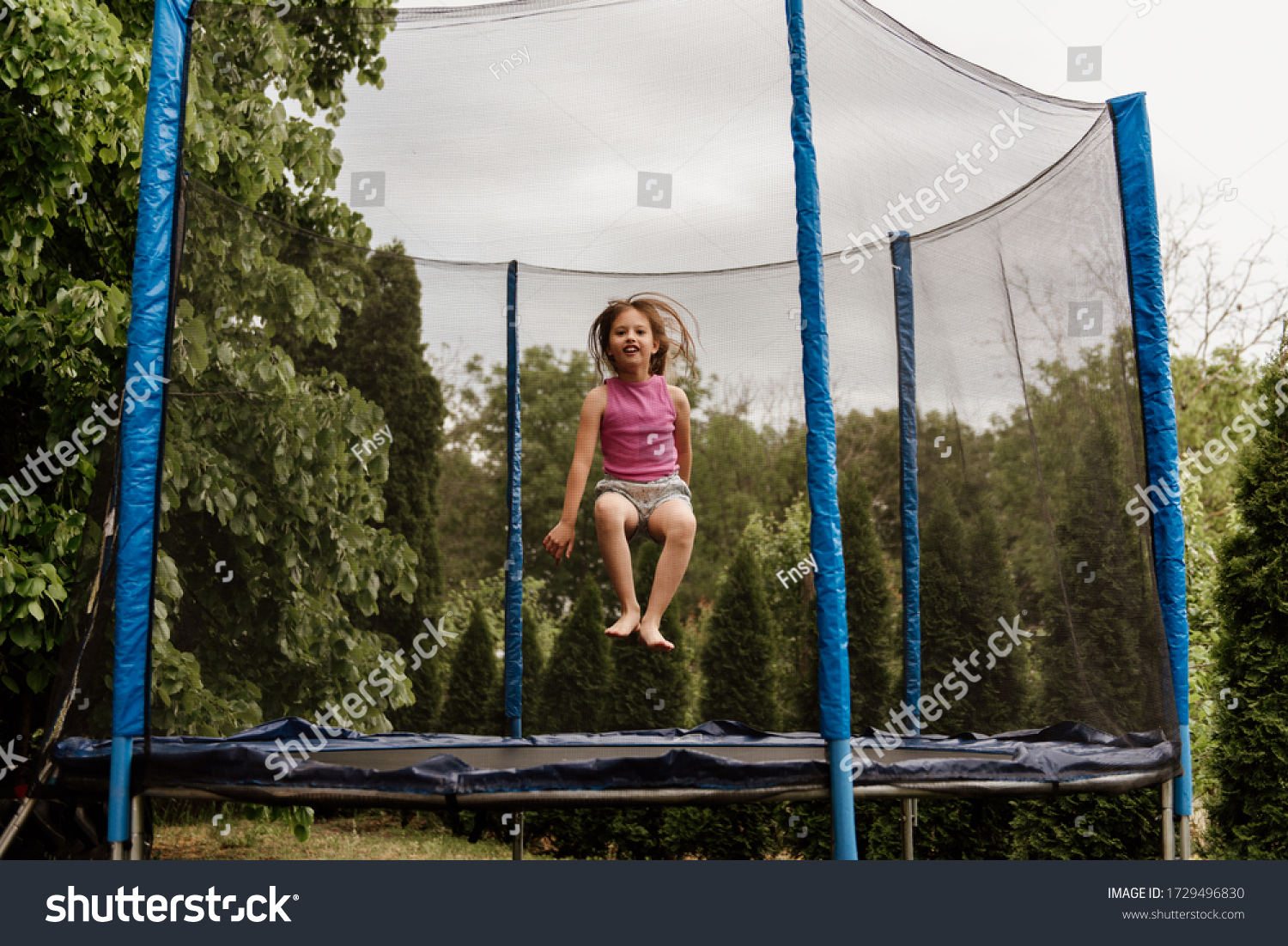 Little Girl Jumping Trampoline Outdoors On Stock Photo 1729496830 ...