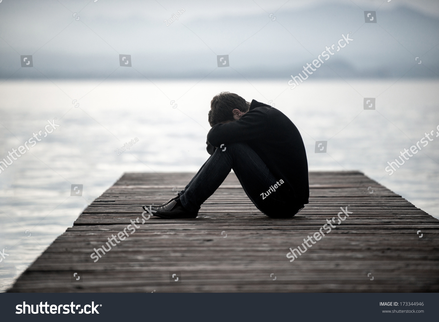 sad guy sitting