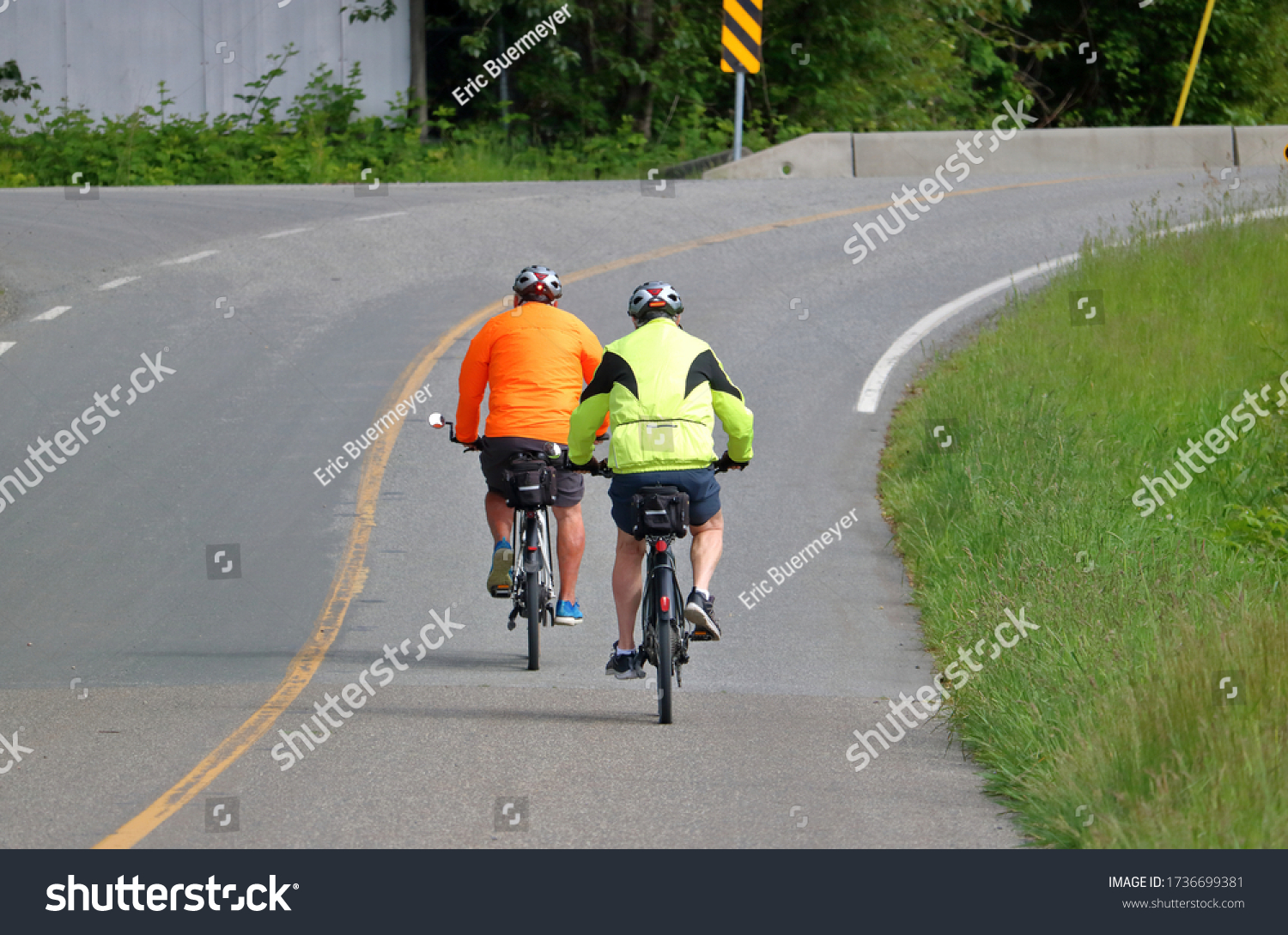 Two Cyclists Wear Bright Reflective Clothing Stock Photo 1736699381