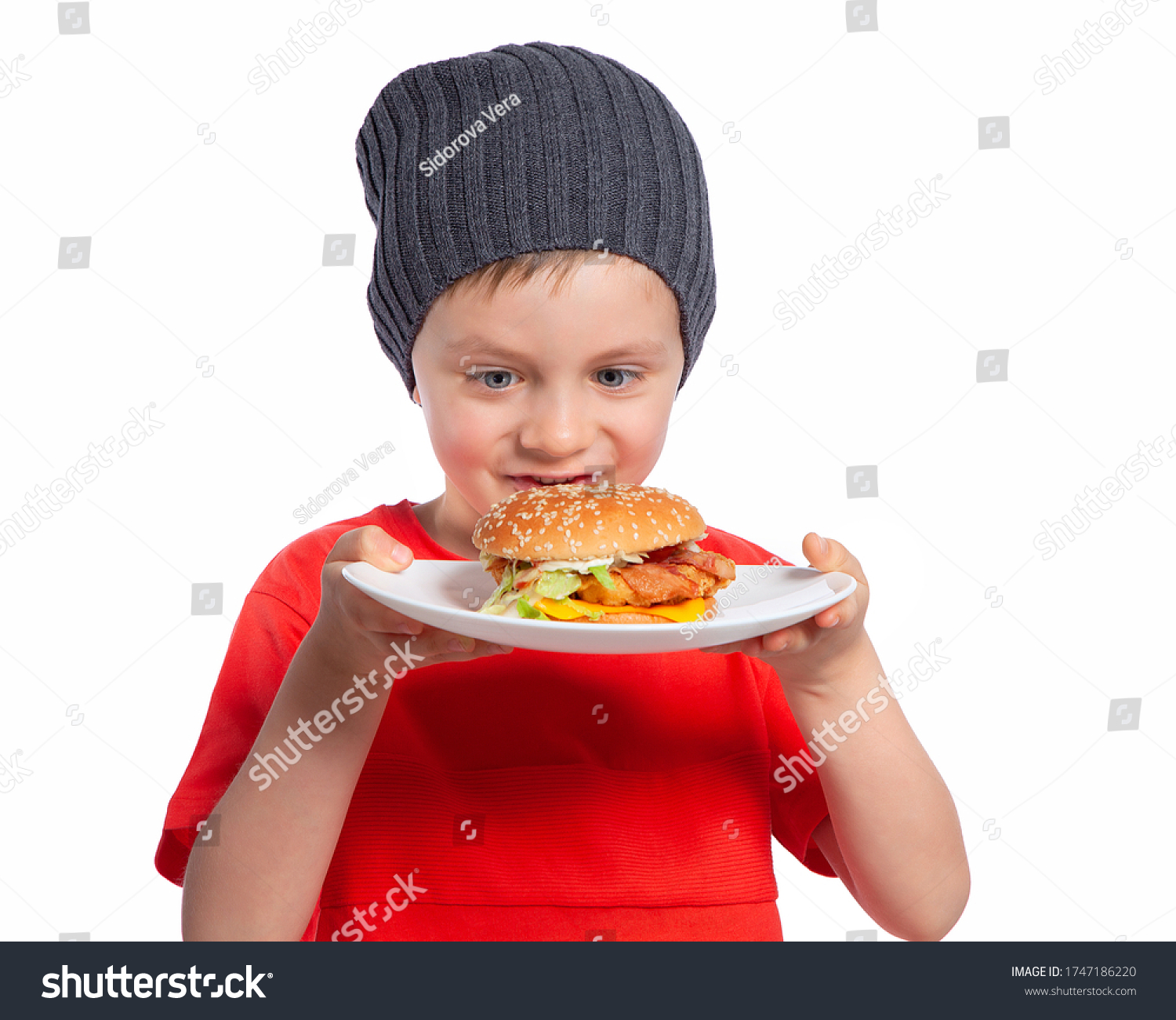 Boy Eats Hamburger Child Looks Burger Stock Photo 1747186220 | Shutterstock