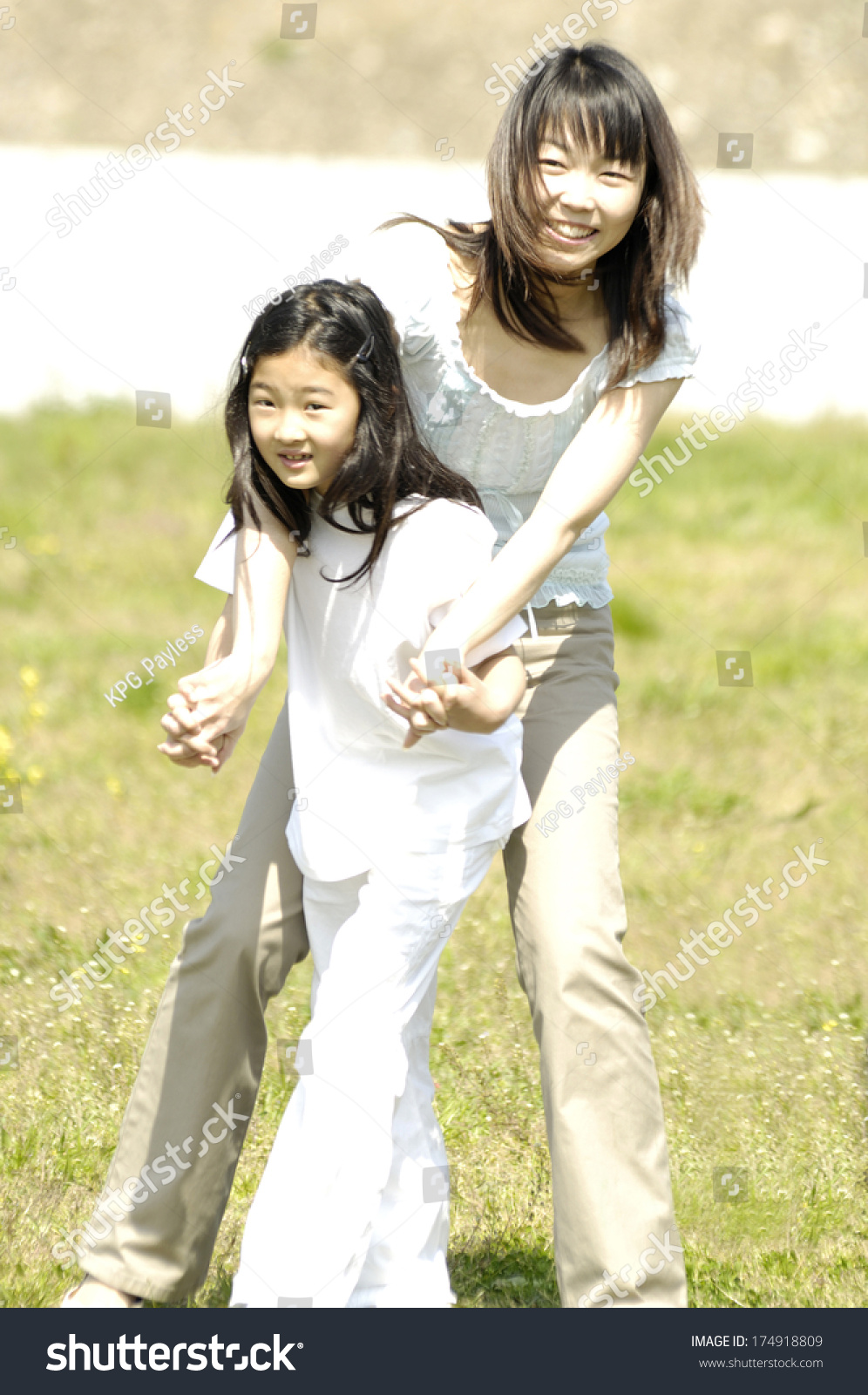 Japanese Mother Daughter Playing Stock