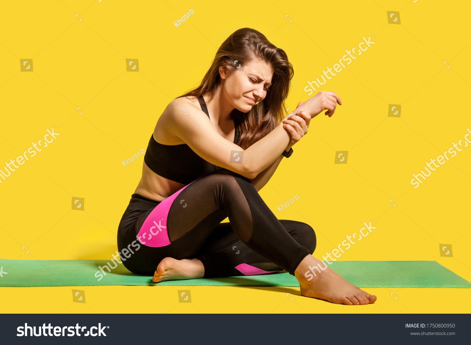 sportswoman-feeling-pain-hand-sitting-on-stock-photo-1750800950