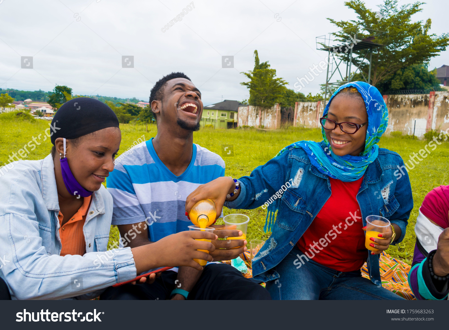 Young Black People Sitting Park Pouring Stock Photo 1759683263 ...