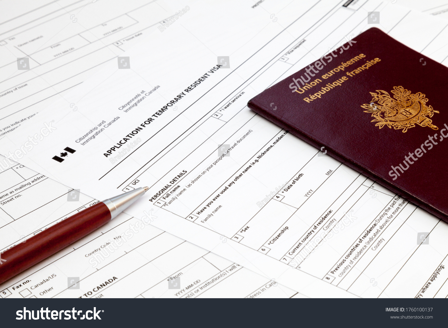 19 215 French Residence Images Stock Photos Vectors Shutterstock   Stock Photo A Ballpoint Pen And A French Passport On The Top Of An Canadian Temporary Resident Visa Application 1760100137 