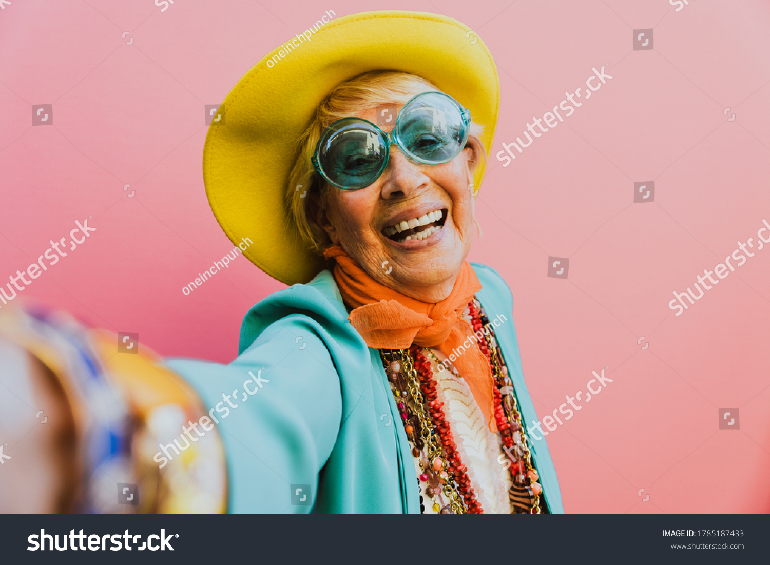 Happy Grandmother Posing On Colored Backgrounds Stock Photo 1785187433 ...