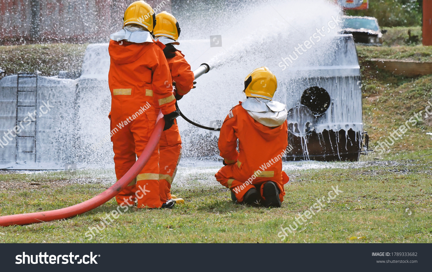 Firefighter Fighting Flame Using Fire Hose Stock Photo 1789333682 ...