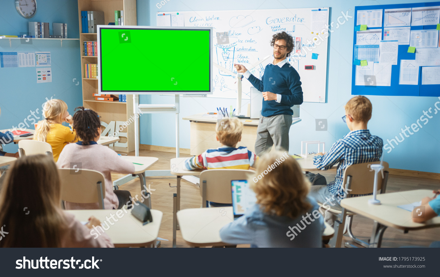 elementary-school-physics-teacher-uses-interactive-stock-photo