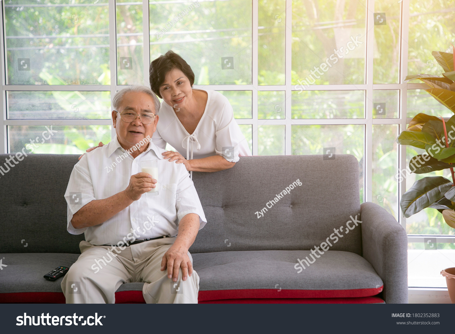 Smiling Asian Senior Couple Drinking Milk Stock Photo 1802352883 ...