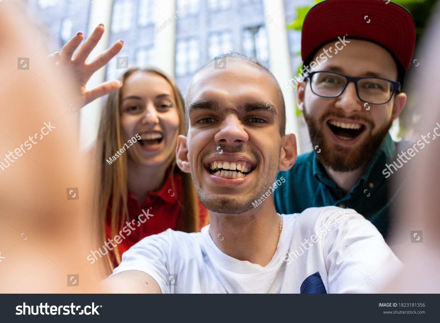 Stock Photo Group Of Friends Taking A Stroll On City S Street In Summer Day Handicapped Man With His Friends 1823181356 