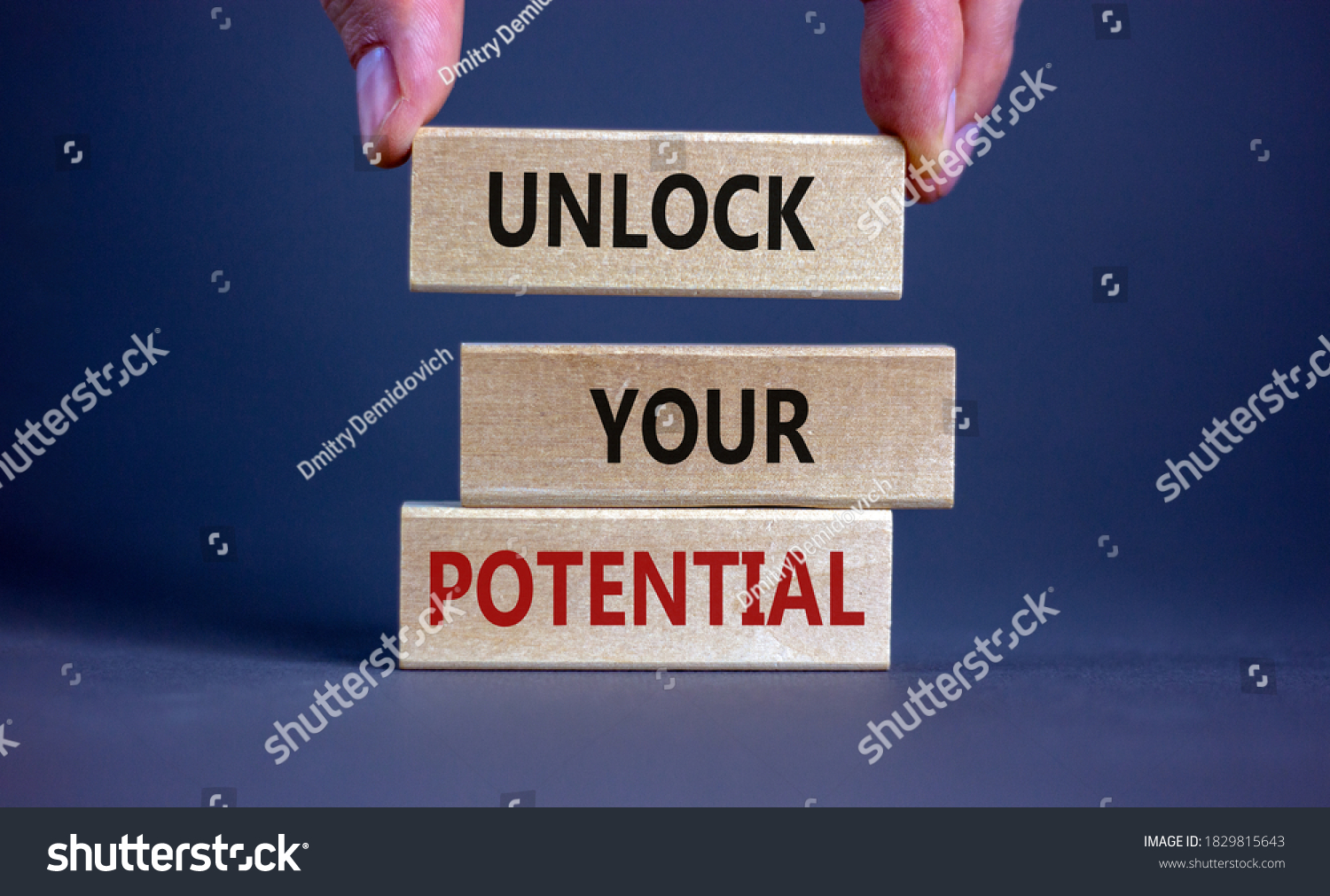 male-hand-placing-block-word-unlock-stock-photo-1829815643-shutterstock