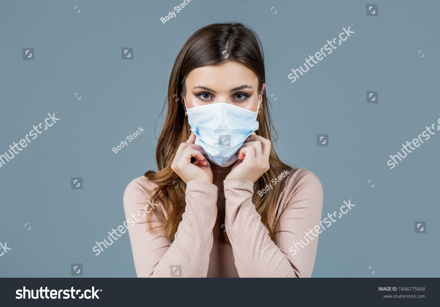Girl Wearing Protective Mask. Woman wearing surgical mask for corona virus. Woman wearing an anti virus protection mask. Woman wearing medical face mask.