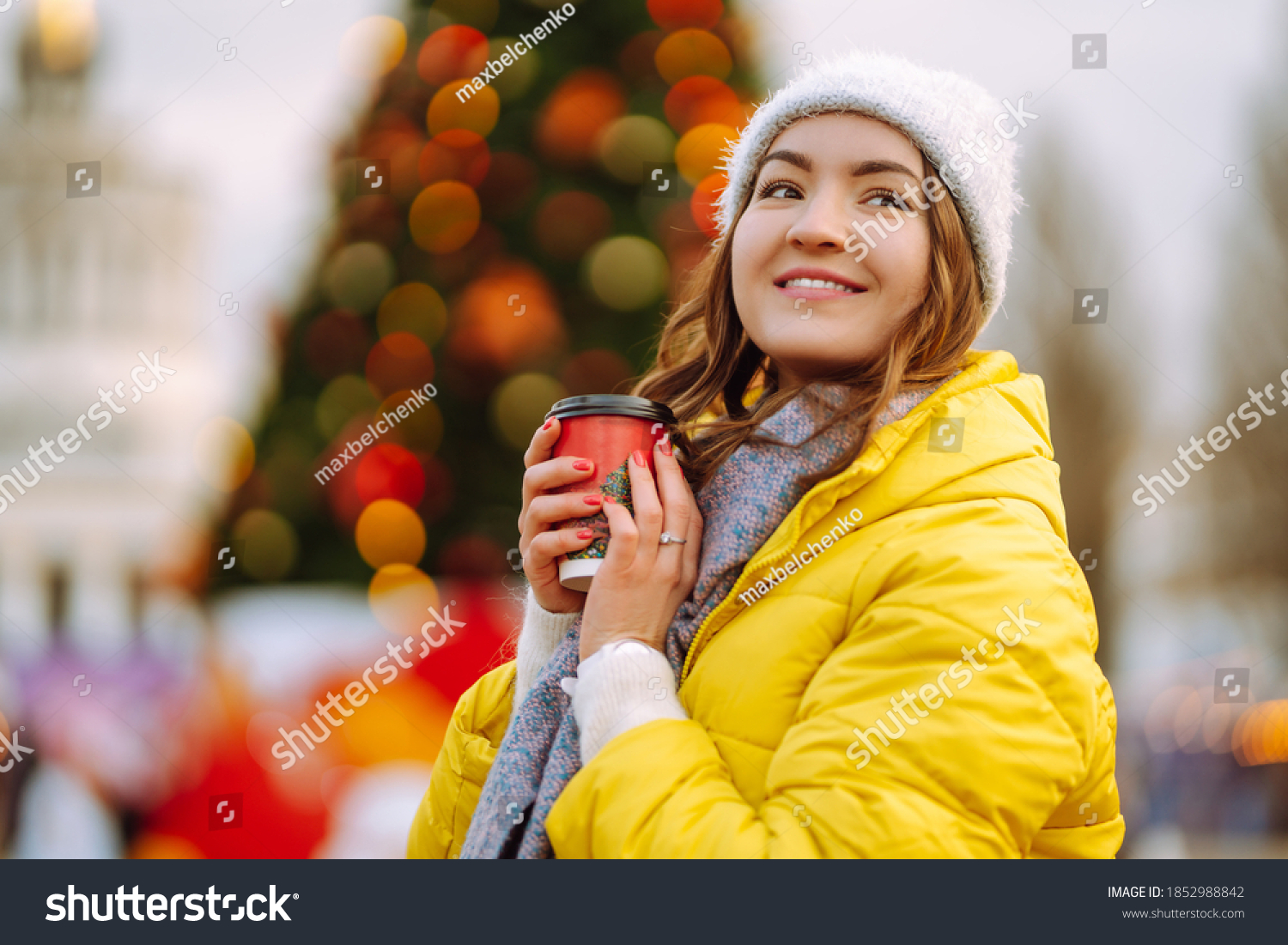 young-woman-drinking-hot-coffee-while-stock-photo-1852988842-shutterstock